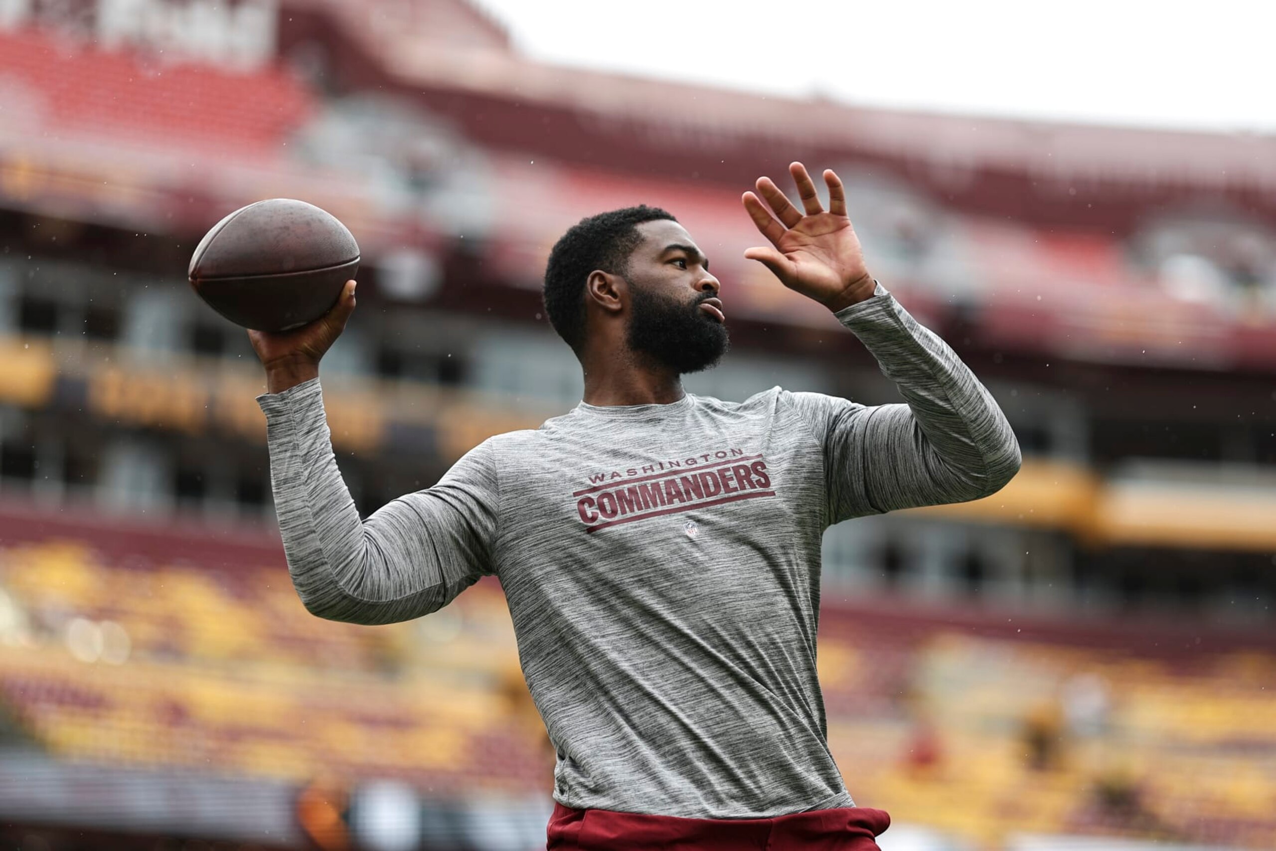 LANDOVER, MARYLAND - SEPTEMBER 10: Jacoby Brissett #12 of the Washington Commanders passes as he warms up prior to a game between the Washington Commanders and the Arizona Cardinals at FedExField on September 10, 2023 in Landover, Maryland. (Photo by Michael Owens/Getty Images) LANDOVER, MARYLAND - SEPTEMBER 10: Jacoby Brissett #12 of the Washington Commanders passes as he warms up prior to a game between the Washington Commanders and the Arizona Cardinals at FedExField on September 10, 2023 in Landover, Maryland. (Photo by Michael Owens/Getty Images)