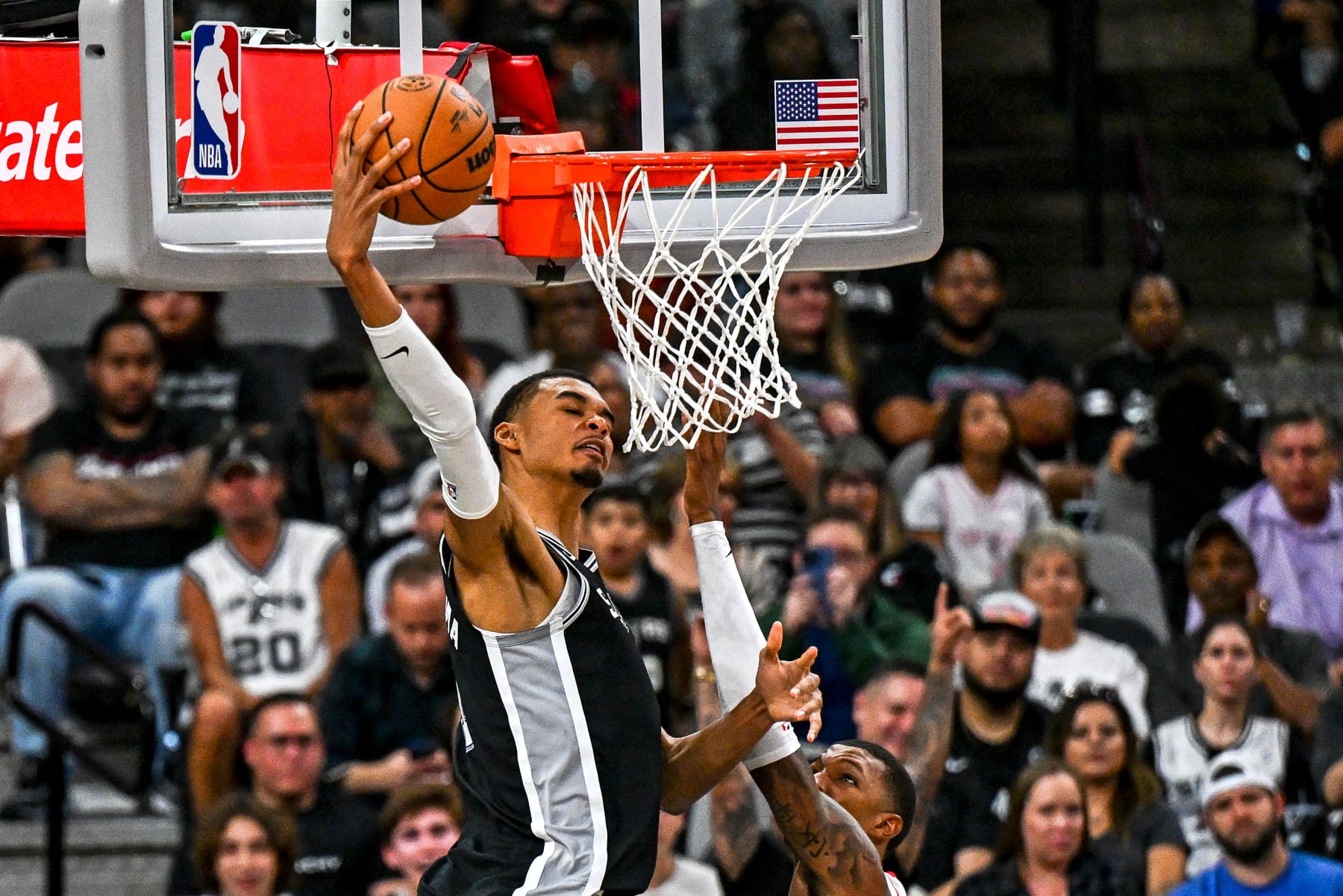 San Antonio Spurs' French forward-center #01 Victor Wembanyama (L) dunks the ball during the NBA basketball game between the Houston Rockets and the San Antonio Spurs at the AT&T Center in San Antonio, Texas, on October 27, 2023. (Photo by CHANDAN KHANNA / AFP) (Photo by CHANDAN KHANNA/AFP via Getty Images)