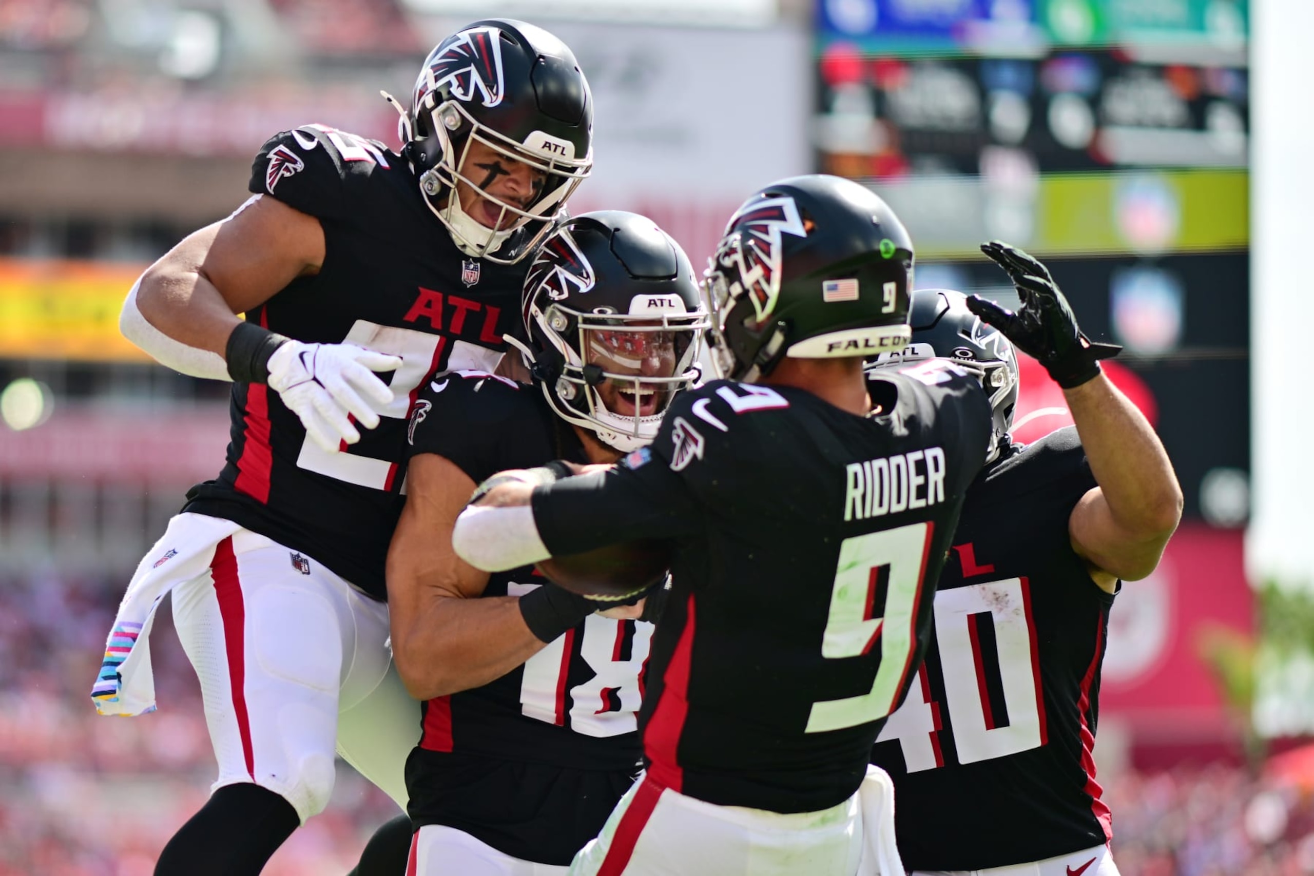 TAMPA, FLORIDA - OCTOBER 22: The Atlanta Falcons celebrate after Desmond Ridder #9 of the Atlanta Falcons scores a touchdown in the first quarter of the game against the Tampa Bay Buccaneers at Raymond James Stadium on October 22, 2023 in Tampa, Florida. (Photo by Julio Aguilar/Getty Images)