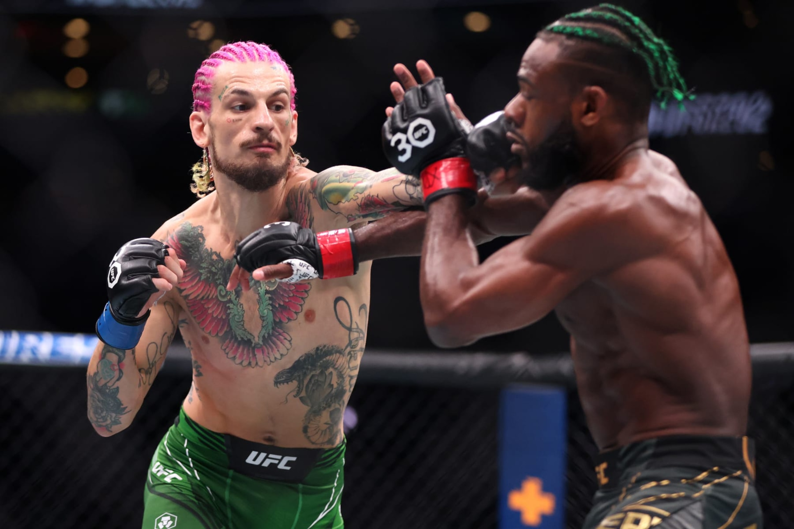 BOSTON, MASSACHUSETTS - AUGUST 19: Sean O’Malley throws a punch against Aljamain Sterling during their Bantamweight title fight at UFC 292 at TD Garden on August 19, 2023 in Boston, Massachusetts. (Photo by Paul Rutherford/Getty Images)