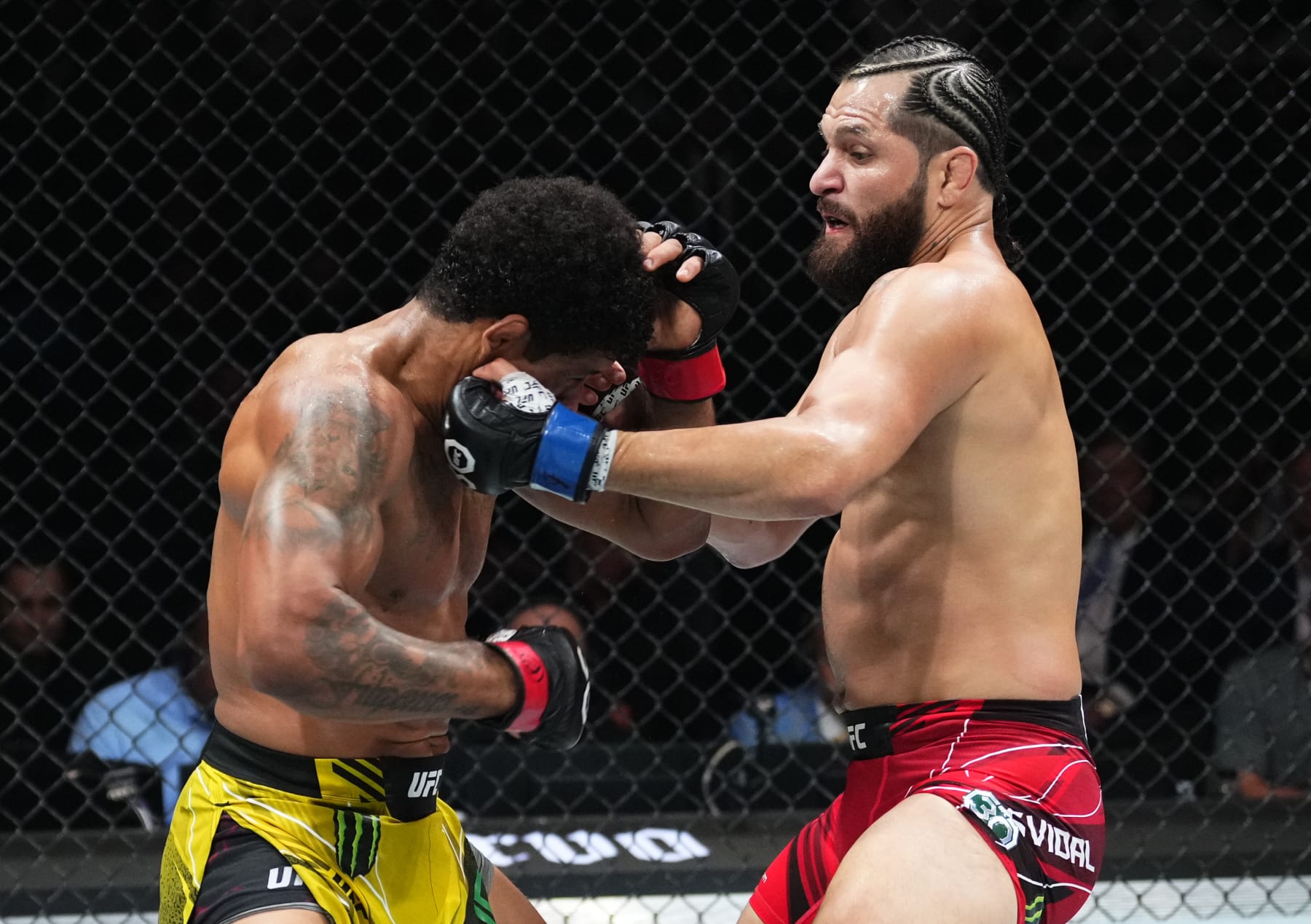 MIAMI, FLORIDA - APRIL 08: (R-L) Jorge Masvidal punches Gilbert Burns of Brazil in a welterweight fight during the UFC 287 event at Kaseya Center on April 08, 2023 in Miami, Florida. (Photo by Jeff Bottari/Zuffa LLC via Getty Images)