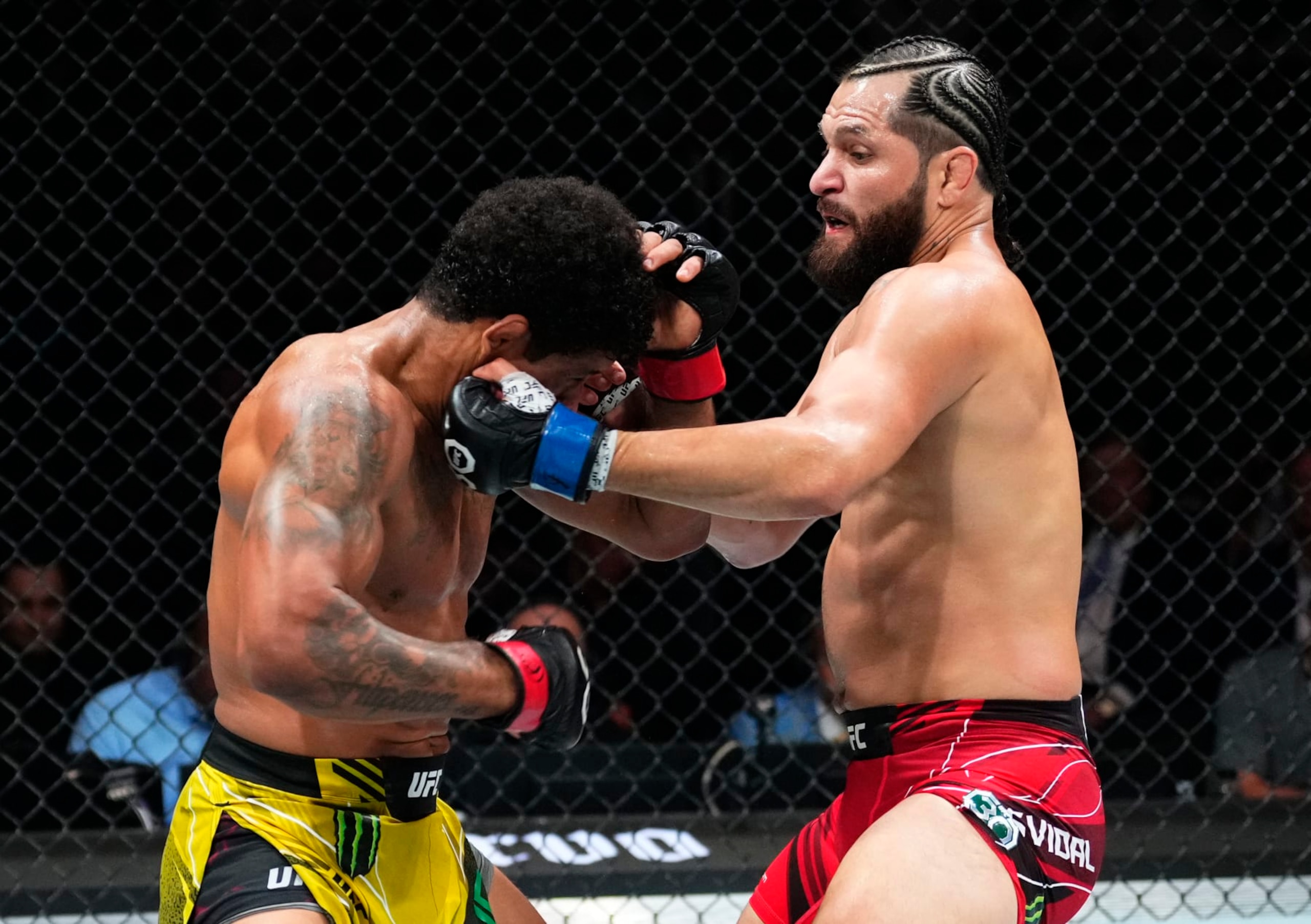 MIAMI, FLORIDA - APRIL 08: (R-L) Jorge Masvidal punches Gilbert Burns of Brazil in a welterweight fight during the UFC 287 event at Kaseya Center on April 08, 2023 in Miami, Florida. (Photo by Jeff Bottari/Zuffa LLC via Getty Images)