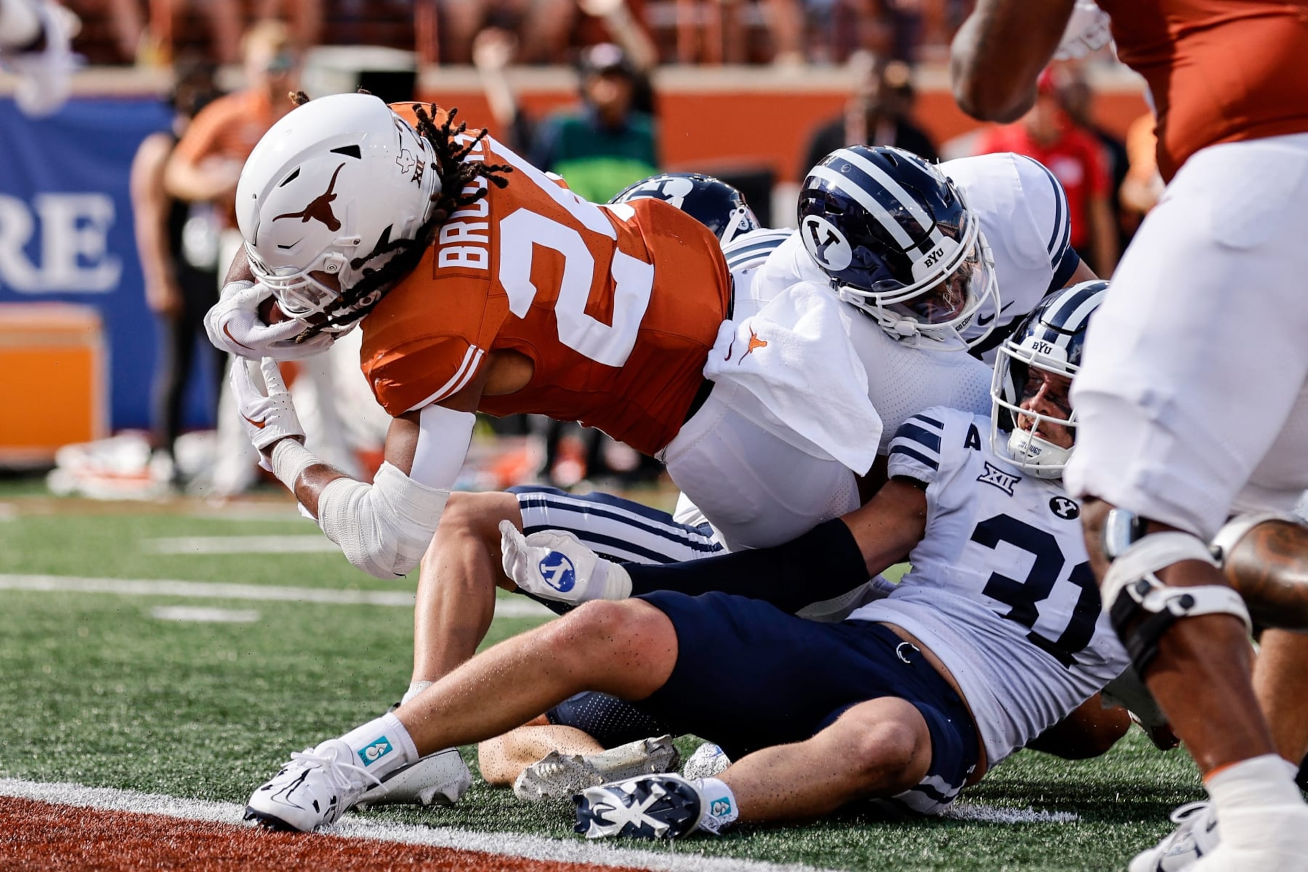AUSTIN, TEXAS - OCTOBER 28: Jonathon Brooks #24 of the Texas Longhorns dives across the goal line for a touchdown in the first half against the Brigham Young Cougars at Darrell K Royal-Texas Memorial Stadium on October 28, 2023 in Austin, Texas. (Photo by Tim Warner/Getty Images)
