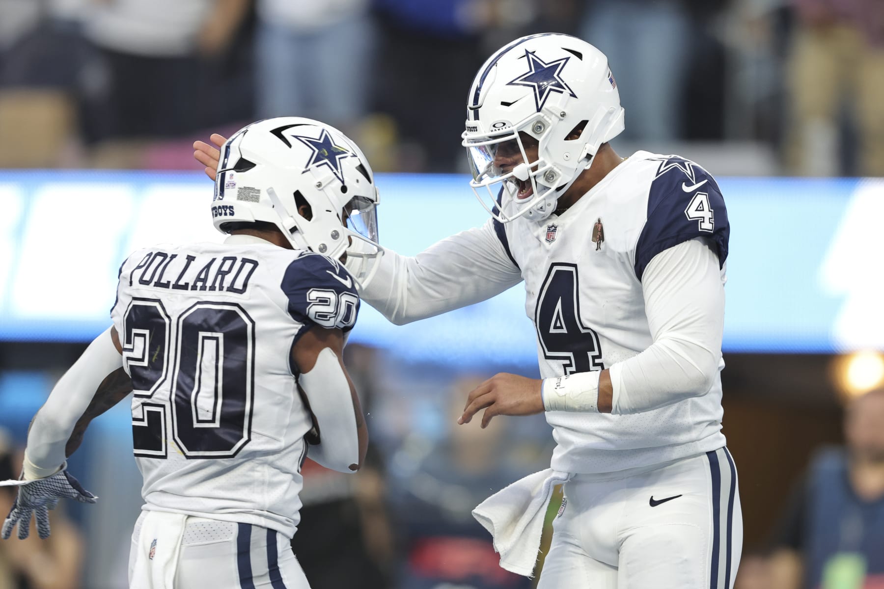 INGLEWOOD, CALIFORNIA - OCTOBER 16: Dak Prescott #4 of the Dallas Cowboys celebrates with Tony Pollard #20 of the Dallas Cowboys after scoring a touchdown during an NFL football game between the Los Angeles Chargers and the Dallas Cowboys at SoFi Stadium on October 16, 2023 in Inglewood, California. (Photo by Michael Owens/Getty Images)