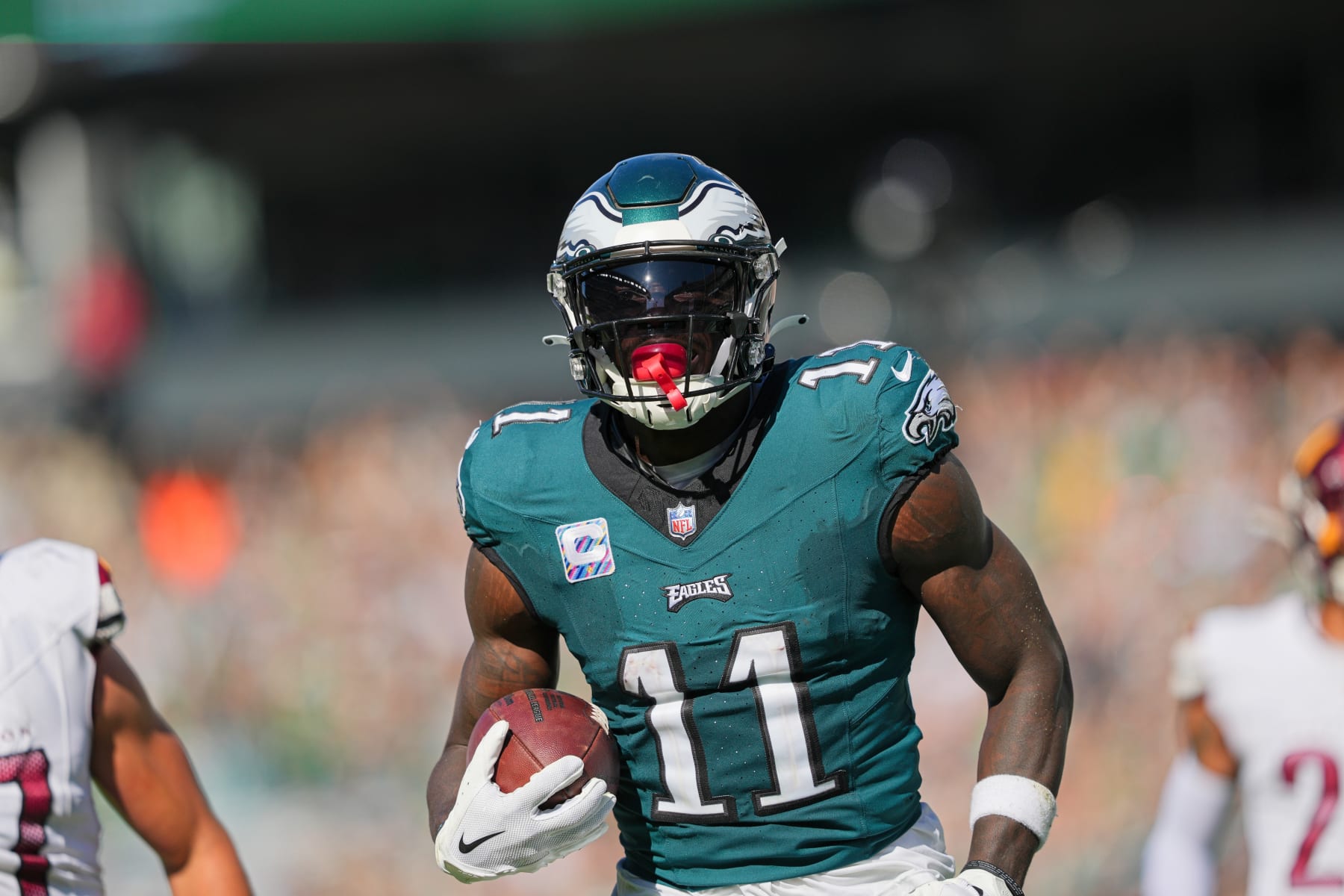 PHILADELPHIA, PA - OCTOBER 01: Philadelphia Eagles wide receiver A.J. Brown (11) runs for a touchdown during the game between the Philadelphia Eagles and the Washington Commanders on October 1, 2023, at Lincoln Financial Field. (Photo by Andy Lewis/Icon Sportswire via Getty Images)