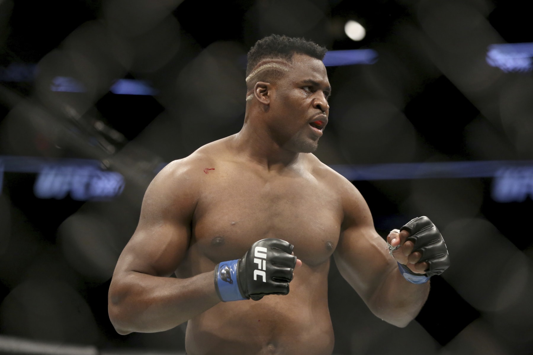 FILE - Francis Ngannou during a heavyweight championship mixed martial arts bout against Stipe Miocic at UFC 220, Sunday, Jan. 21, 2018, in Boston. Being the best heavyweight boxer in the world isn’t enough for Tyson Fury. He has appeared in WWE, been the subject of a Netflix reality series and is now in the Middle East to fight a former UFC star in the latest in a crossover bouts. Fighting Francis Ngannou on Saturday, Oct. 28, 2023 will earn Fury a reported $50 million. (AP Photo/Gregory Payan, File)