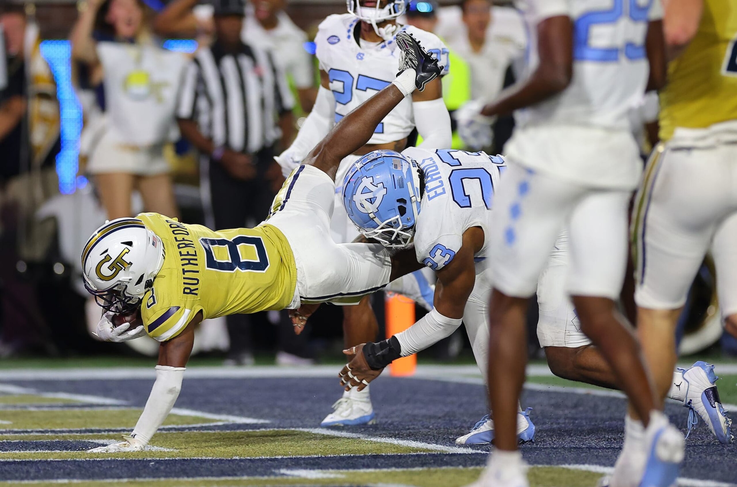 ATLANTA, GEORGIA - OCTOBER 28:  Malik Rutherford #8 of the Georgia Tech Yellow Jackets dives for this touchdown against Power Echols #23 of the North Carolina Tar Heels during the second quarter at Bobby Dodd Stadium on October 28, 2023 in Atlanta, Georgia. (Photo by Kevin C. Cox/Getty Images)