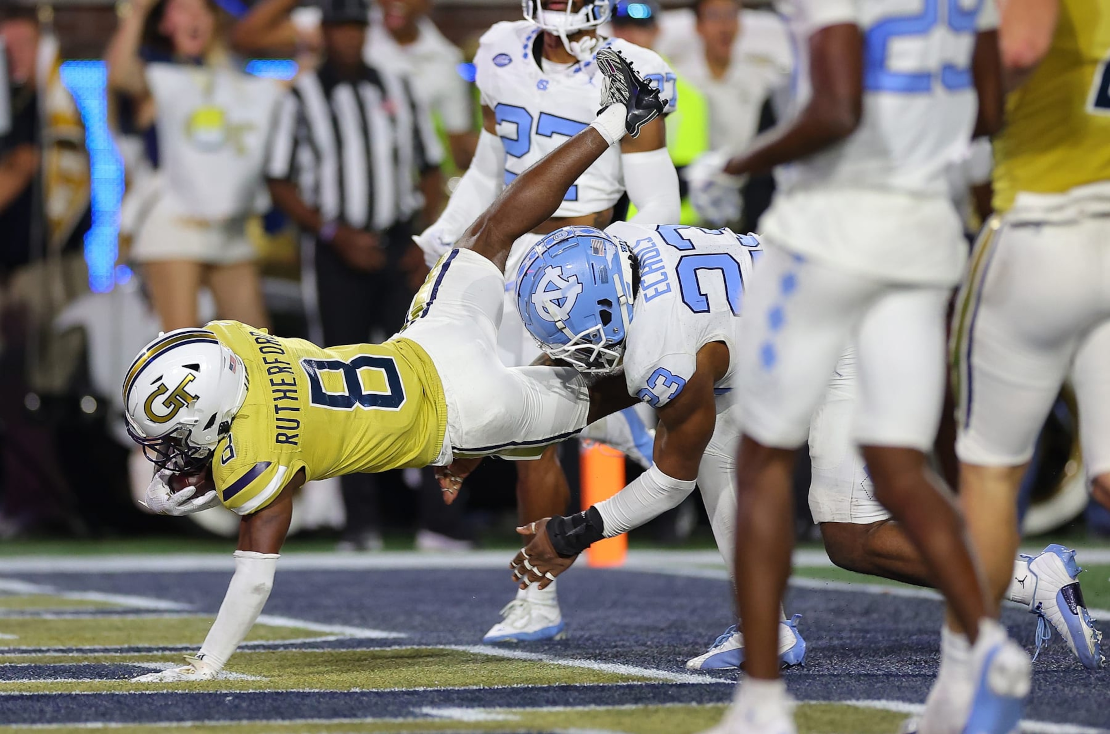 ATLANTA, GEORGIA - OCTOBER 28:  Malik Rutherford #8 of the Georgia Tech Yellow Jackets dives for this touchdown against Power Echols #23 of the North Carolina Tar Heels during the second quarter at Bobby Dodd Stadium on October 28, 2023 in Atlanta, Georgia. (Photo by Kevin C. Cox/Getty Images)