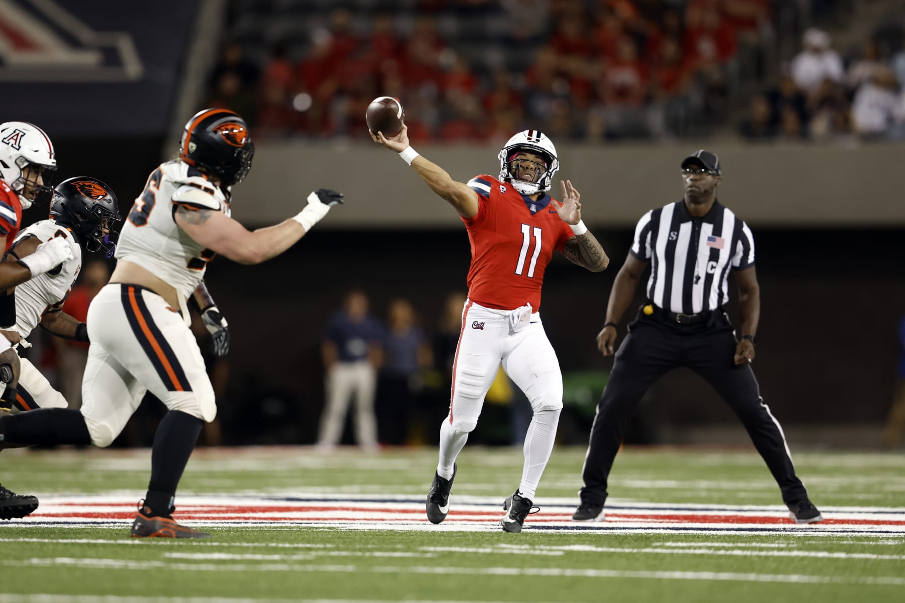 TUCSON, ARIZONA - OCTOBER 28: Quarterback Noah Fifita #11 of the Arizona Wildcats throws a pass during the first half against the Oregon State Beavers at Arizona Stadium on October 28, 2023 in Tucson, Arizona. (Photo by Chris Coduto/Getty Images)