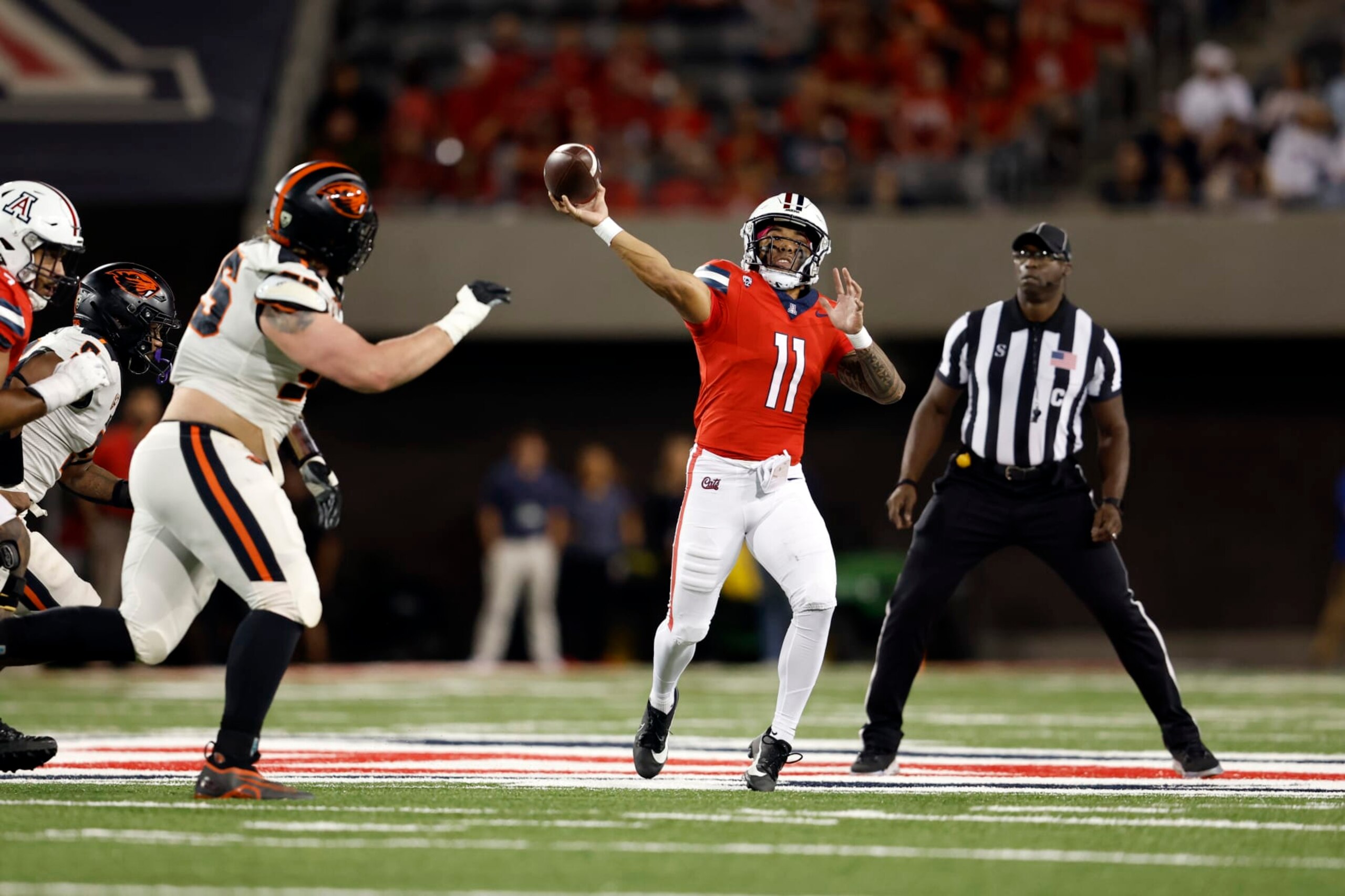 TUCSON, ARIZONA - OCTOBER 28: Quarterback Noah Fifita #11 of the Arizona Wildcats throws a pass during the first half against the Oregon State Beavers at Arizona Stadium on October 28, 2023 in Tucson, Arizona. (Photo by Chris Coduto/Getty Images)
