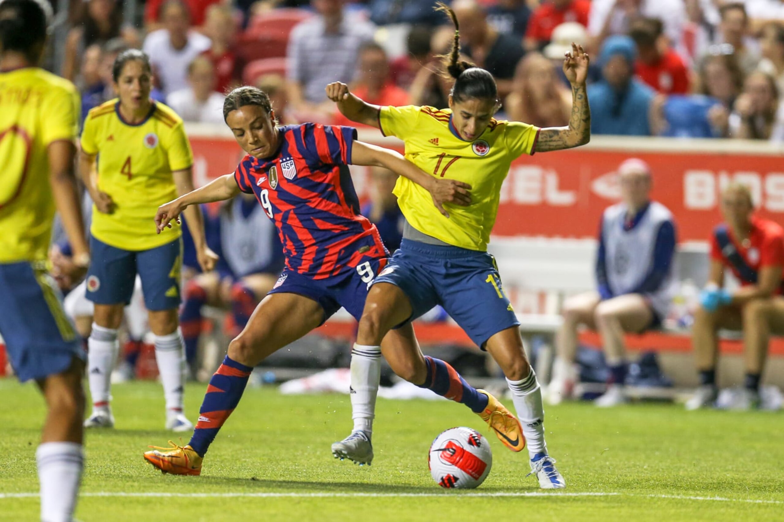 SANDY, UT - JUNE 28: Mallory Pugh #9 of the United States fights for a ball with Carolina Arias #17 of Colombia during a game between Colombia and USWNT at Rio Tinto Stadium on June 28, 2022 in Sandy, Utah. (Photo by Erin Chang/ISI Photos/Getty Images)