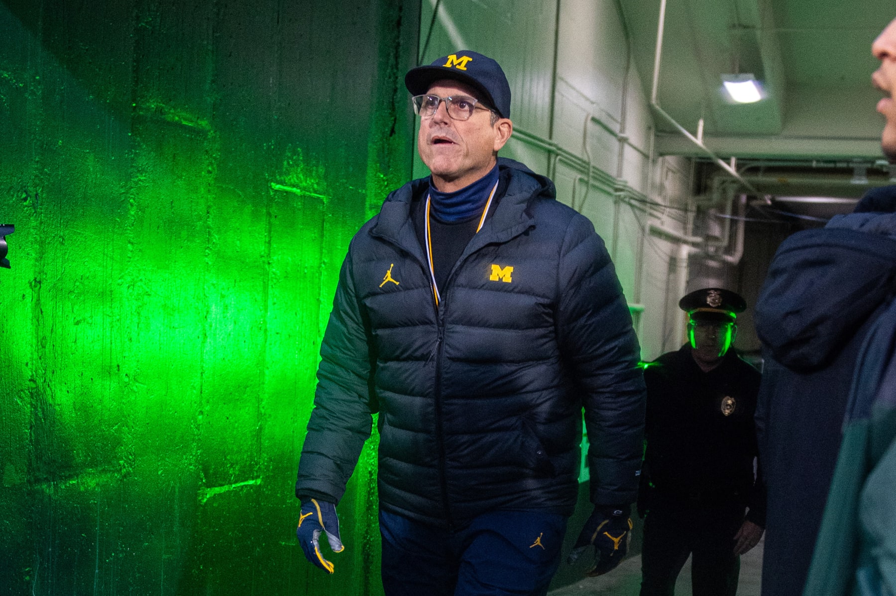 EAST LANSING, MICHIGAN - OCTOBER 21: Head coach Jim Harbaugh of the Michigan Wolverines exits the tunnel before a college football game between the Michigan Wolverines and the Michigan State Spartans at Spartan Stadium on October 21, 2023 in East Lansing, Michigan. (Photo by Aaron J. Thornton/Getty Images)