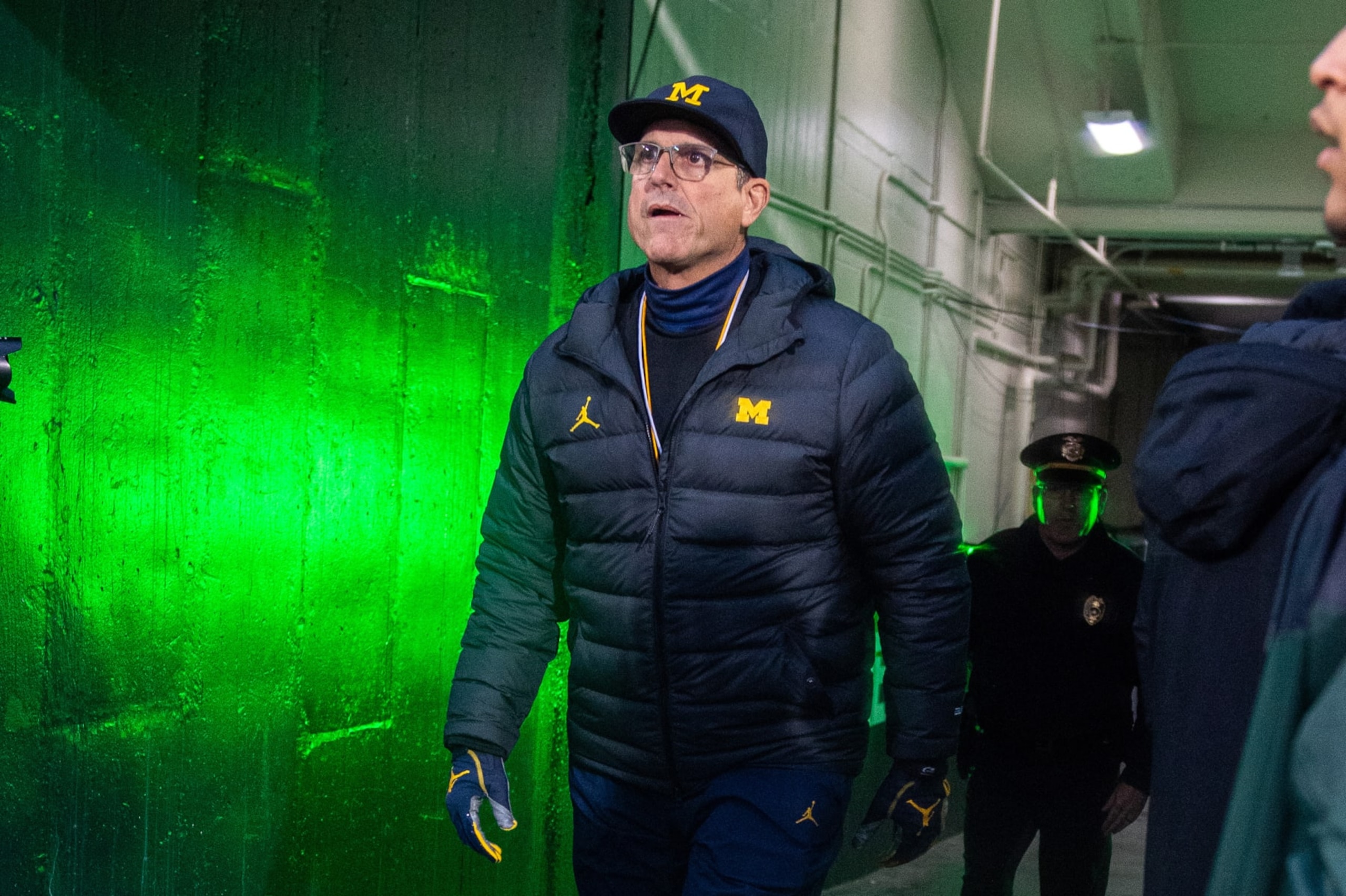 EAST LANSING, MICHIGAN - OCTOBER 21: Head coach Jim Harbaugh of the Michigan Wolverines exits the tunnel before a college football game between the Michigan Wolverines and the Michigan State Spartans at Spartan Stadium on October 21, 2023 in East Lansing, Michigan. (Photo by Aaron J. Thornton/Getty Images)