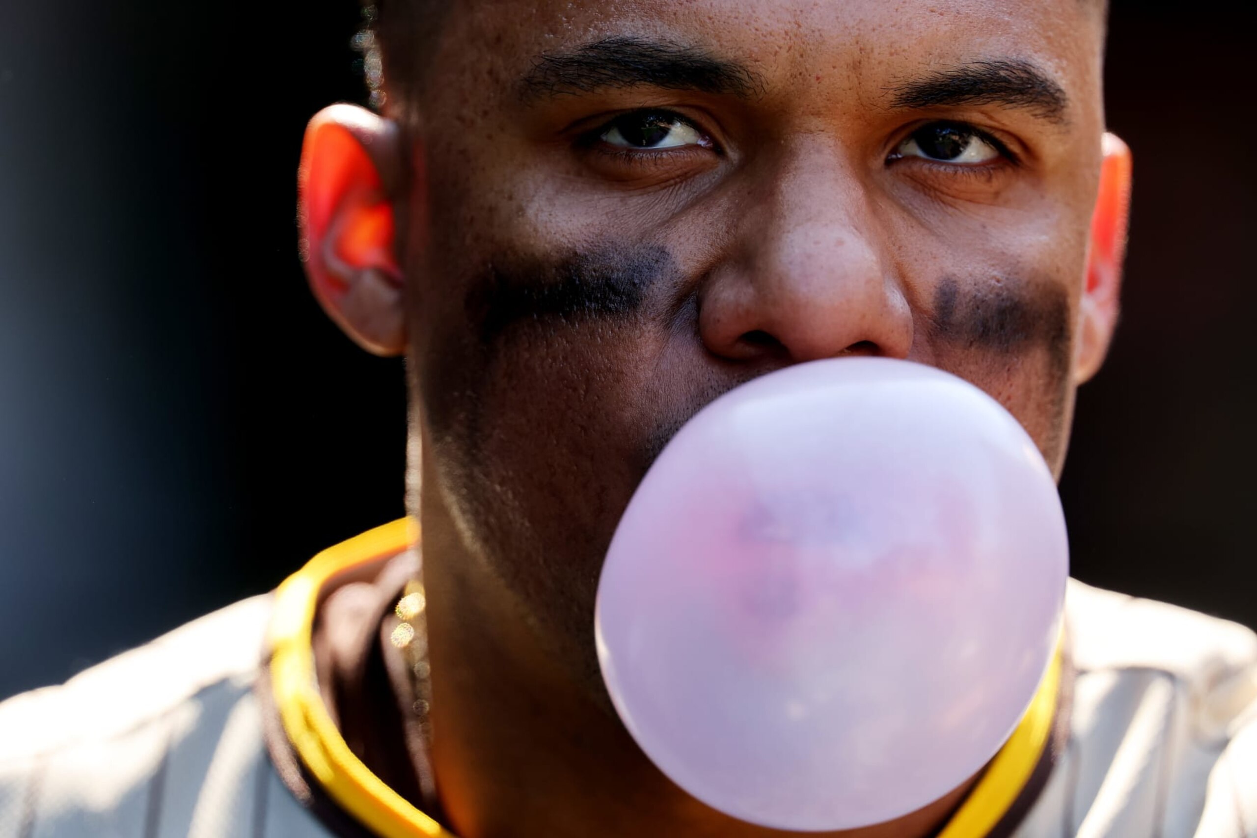 CHICAGO, ILLINOIS - APRIL 27: Juan Soto #22 of the San Diego Padres blows a bubble against the Chicago Cubs during the seventh inning at Wrigley Field on April 27, 2023 in Chicago, Illinois. (Photo by Michael Reaves/Getty Images) CHICAGO, ILLINOIS - APRIL 27: Juan Soto #22 of the San Diego Padres blows a bubble against the Chicago Cubs during the seventh inning at Wrigley Field on April 27, 2023 in Chicago, Illinois. (Photo by Michael Reaves/Getty Images)