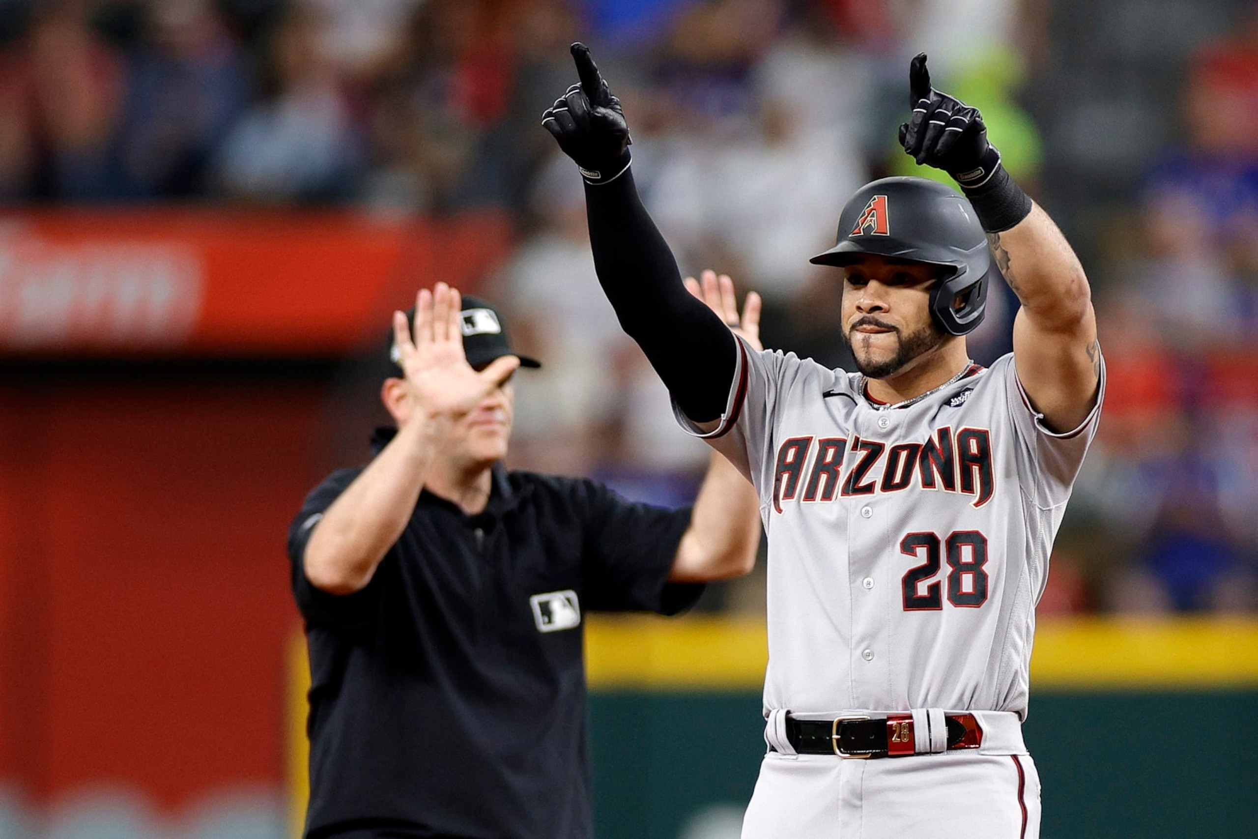 ARLINGTON, TEXAS - OCTOBER 28: Tommy Pham #28 of the Arizona Diamondbacks celebrates after hitting a double in the fourth inning against the Texas Rangers during Game Two of the World Series at Globe Life Field on October 28, 2023 in Arlington, Texas. (Photo by Carmen Mandato/Getty Images)
