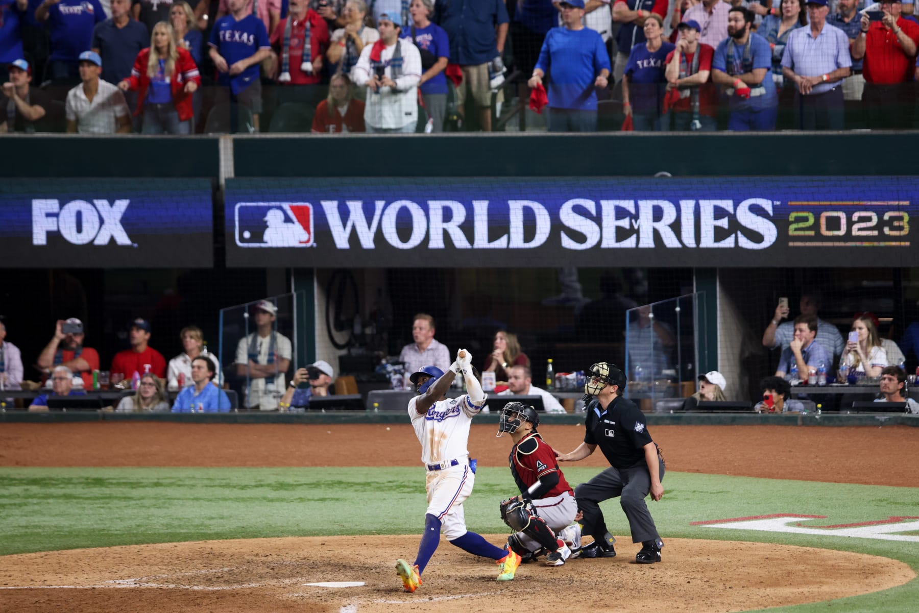 ARLINGTON, TX - OCTOBER 27:   Adolis Garcia #53 of the Texas Rangers hits a walk-off solo home run in the eleventh inning during Game 1 of the 2023 World Series between the Arizona Diamondbacks and the Texas Rangers at Globe Life Field on Friday, October 27, 2023 in Arlington, Texas. (Photo by Rob Tringali/MLB Photos via Getty Images)