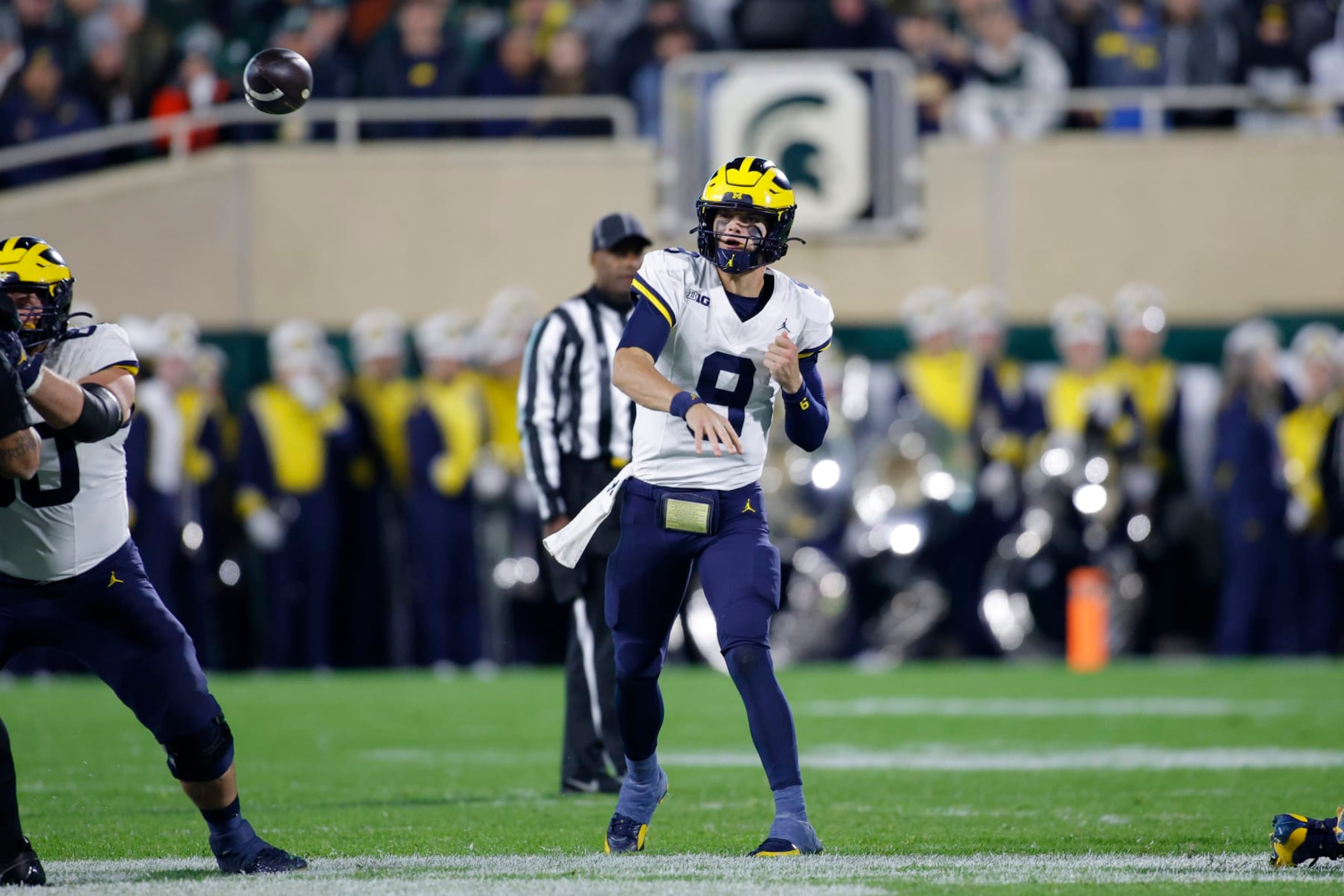 Michigan quarterback J.J. McCarthy throws a pass during an NCAA college football game against Michigan State, Saturday, Oct. 21, 2023, in East Lansing, Mich. (AP Photo/Al Goldis)