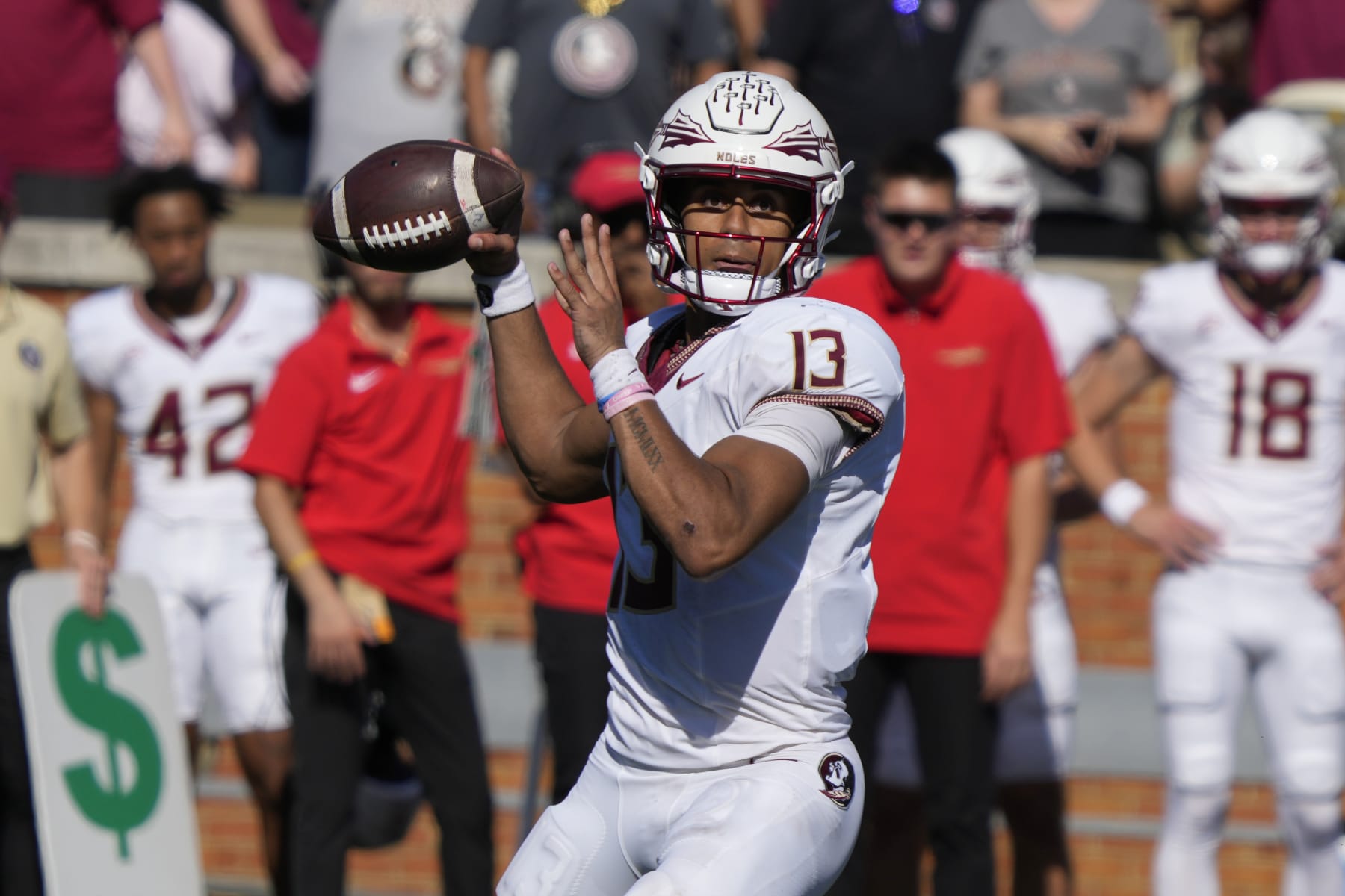 Florida State quarterback Jordan Travis (13) looks to pass against Wake Forest during the second half of an NCAA college football game in Winston-Salem, N.C., Saturday, Oct. 28, 2023. (AP Photo/Chuck Burton)