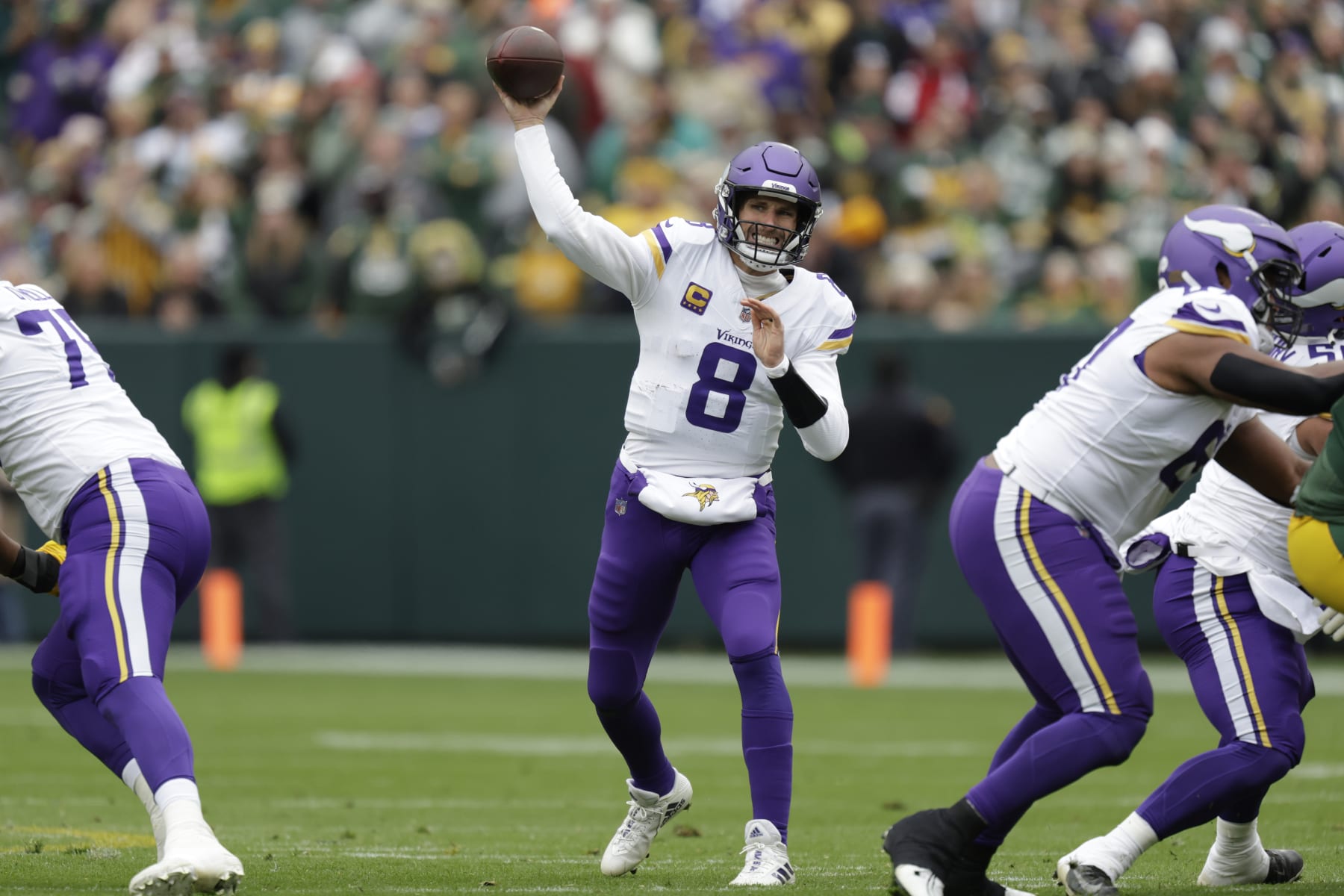 Minnesota Vikings quarterback Kirk Cousins (8) passes during the first half of an NFL football game against the Green Bay Packers, Sunday, Oct. 29, 2023, in Green Bay, Wis. (AP Photo/Matt Ludtke)
