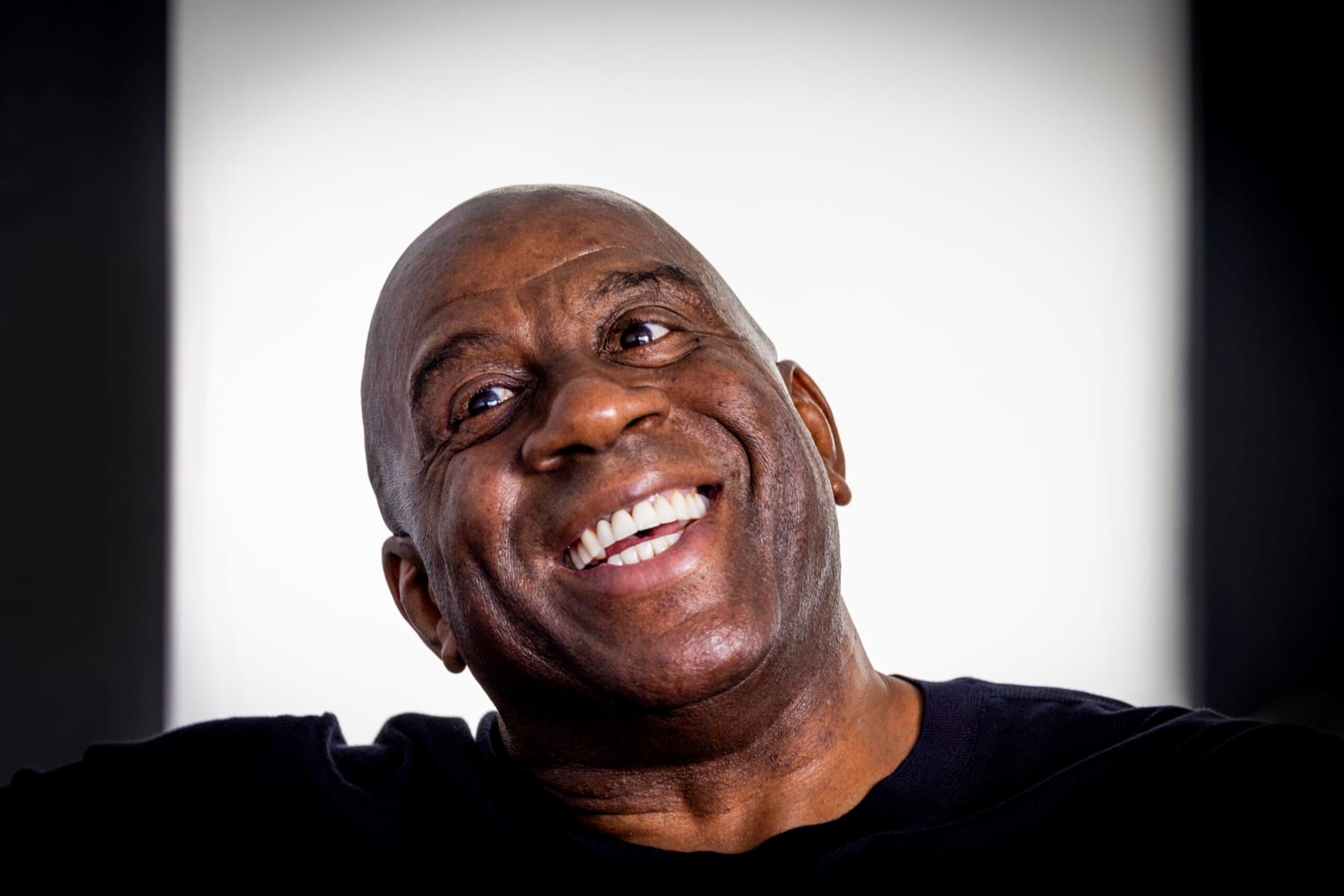 Los Angeles, CA - October 17: Lakers legend Earvin "Magic" Johnson talks to a Los Angeles Times reporter during an interview before he and GSK were joined by healthcare professionals and patient advocates to educate and raise awareness on the risk of Respiratory Syncytial Virus (RSV) infection for people 60 years of age and older at the Crenshaw Family YMCA in Los Angeles Tuesday, Oct. 17, 2023. (Allen J. Schaben / Los Angeles Times via Getty Images) Los Angeles, CA - October 17: Lakers legend Earvin "Magic" Johnson talks to a Los Angeles Times reporter during an interview before he and GSK were joined by healthcare professionals and patient advocates to educate and raise awareness on the risk of Respiratory Syncytial Virus (RSV) infection for people 60 years of age and older at the Crenshaw Family YMCA in Los Angeles Tuesday, Oct. 17, 2023. (Allen J. Schaben / Los Angeles Times via Getty Images)