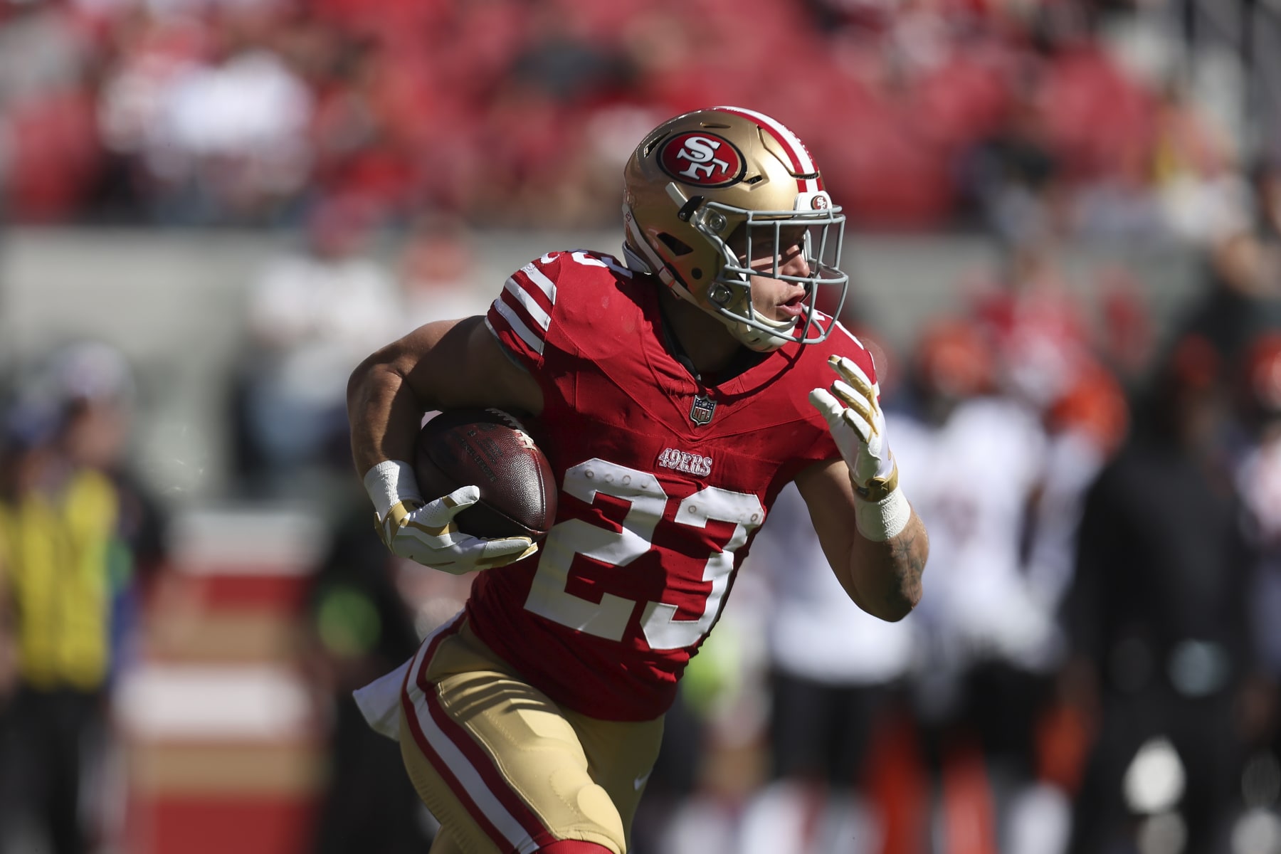 San Francisco 49ers running back Christian McCaffrey (23) runs against the Cincinnati Bengals during the first half of an NFL football game in Santa Clara, Calif., Sunday, Oct. 29, 2023. (AP Photo/Jed Jacobsohn)