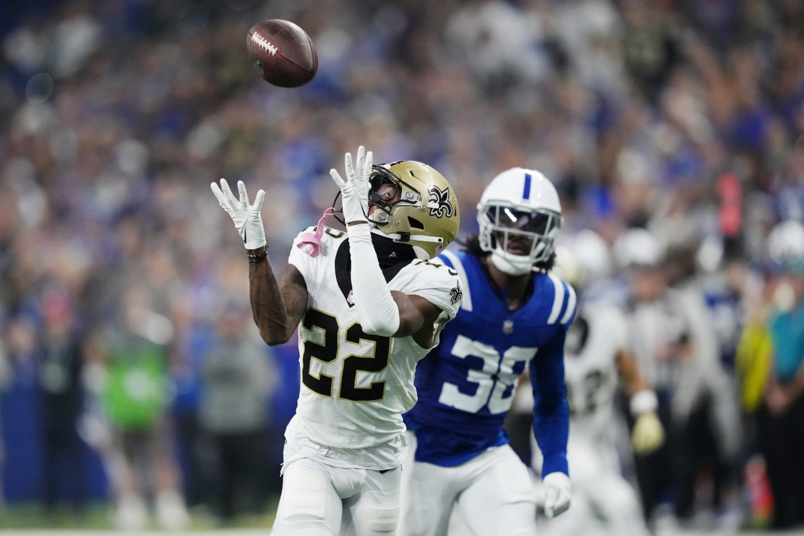 INDIANAPOLIS, INDIANA - OCTOBER 29: Rashid Shaheed #22 of the New Orleans Saints catches a touchdown pass while Tony Brown #38 of the Indianapolis Colts pursues during the second quarter at Lucas Oil Stadium on October 29, 2023 in Indianapolis, Indiana. (Photo by Dylan Buell/Getty Images)