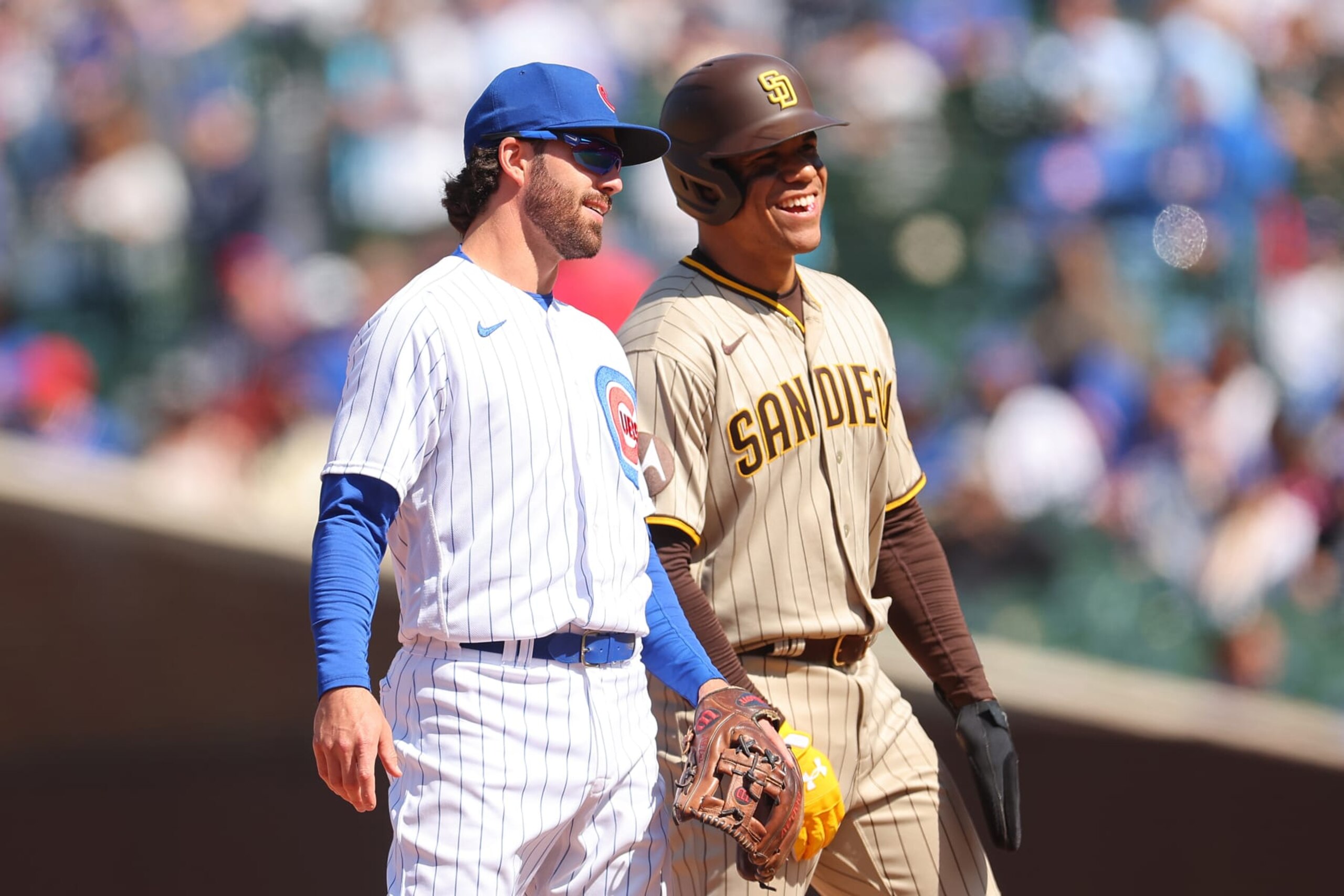 CHICAGO, ILLINOIS - APRIL 27: Dansby Swanson #7 of the Chicago Cubs laughs with Juan Soto #22 of the San Diego Padres at Wrigley Field on April 27, 2023 in Chicago, Illinois. (Photo by Michael Reaves/Getty Images)