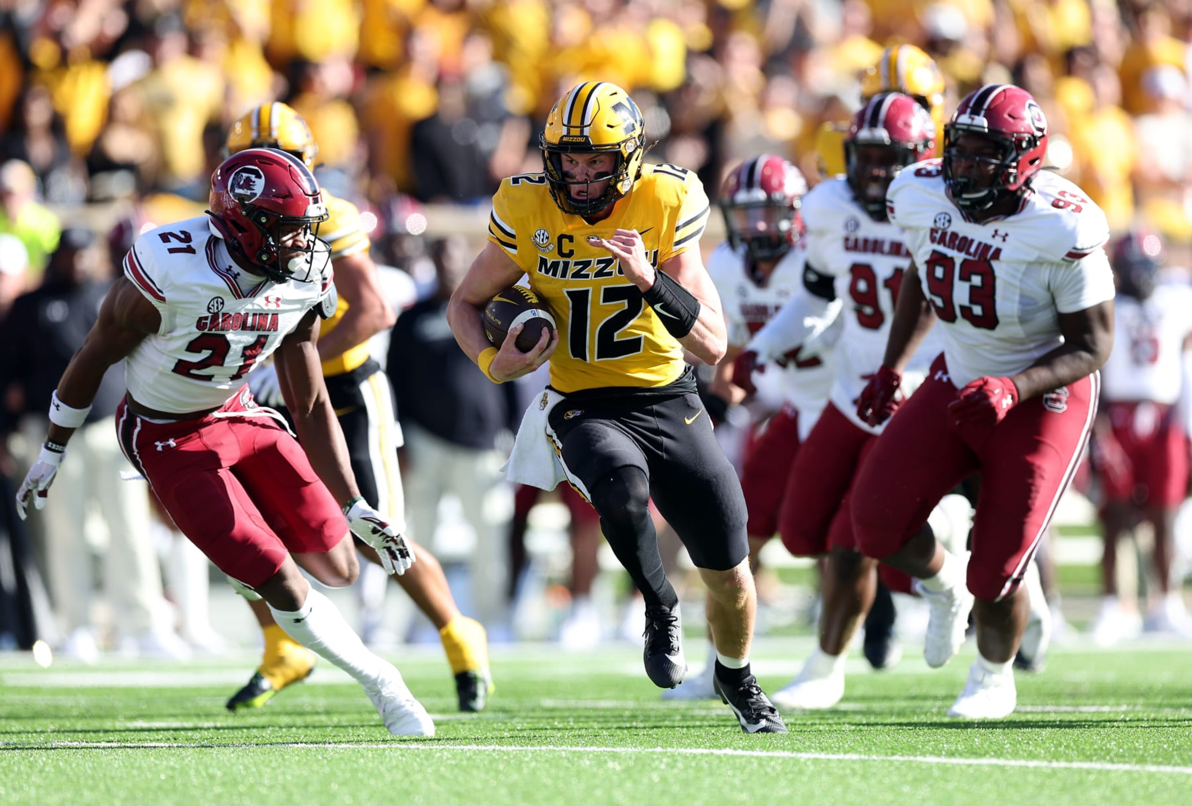 COLUMBIA, MISSOURI - OCTOBER 21: Quarterback Brady Cook #12 of the Missouri Tigers carries the ball for a touchdown during the 1st half of the game against the South Carolina Gamecocks at Faurot Field/Memorial Stadium on October 21, 2023 in Columbia, Missouri. (Photo by Jamie Squire/Getty Images) COLUMBIA, MISSOURI - OCTOBER 21: Quarterback Brady Cook #12 of the Missouri Tigers carries the ball for a touchdown during the 1st half of the game against the South Carolina Gamecocks at Faurot Field/Memorial Stadium on October 21, 2023 in Columbia, Missouri. (Photo by Jamie Squire/Getty Images)
