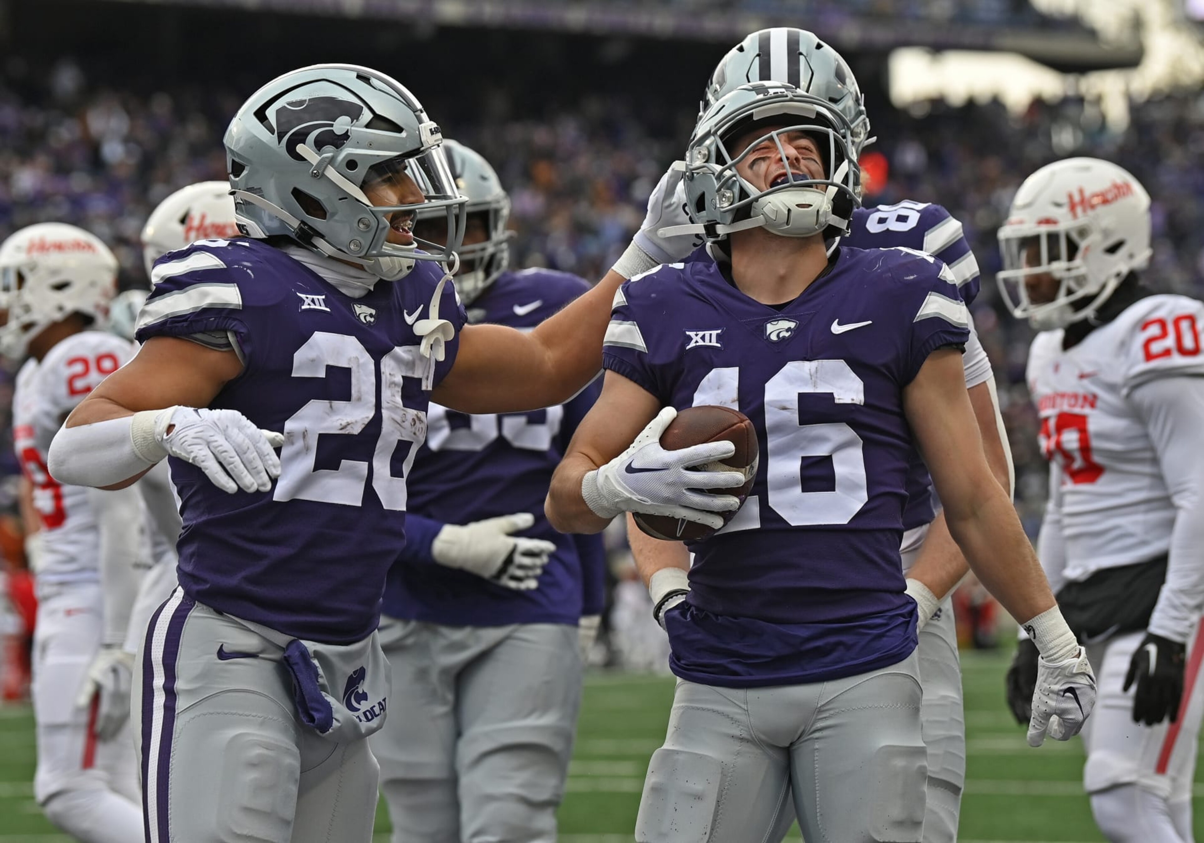MANHATTAN, KS - OCTOBER 28: Seth Porter #16 of the Kansas State Wildcats celebrates with Anthony Frias II #26 after scoring a touchdown in the second half against the Houston Cougars at Bill Snyder Family Football Stadium on October 28, 2023 in Manhattan, Kansas. (Photo by Peter Aiken/Getty Images) MANHATTAN, KS - OCTOBER 28: Seth Porter #16 of the Kansas State Wildcats celebrates with Anthony Frias II #26 after scoring a touchdown in the second half against the Houston Cougars at Bill Snyder Family Football Stadium on October 28, 2023 in Manhattan, Kansas. (Photo by Peter Aiken/Getty Images)