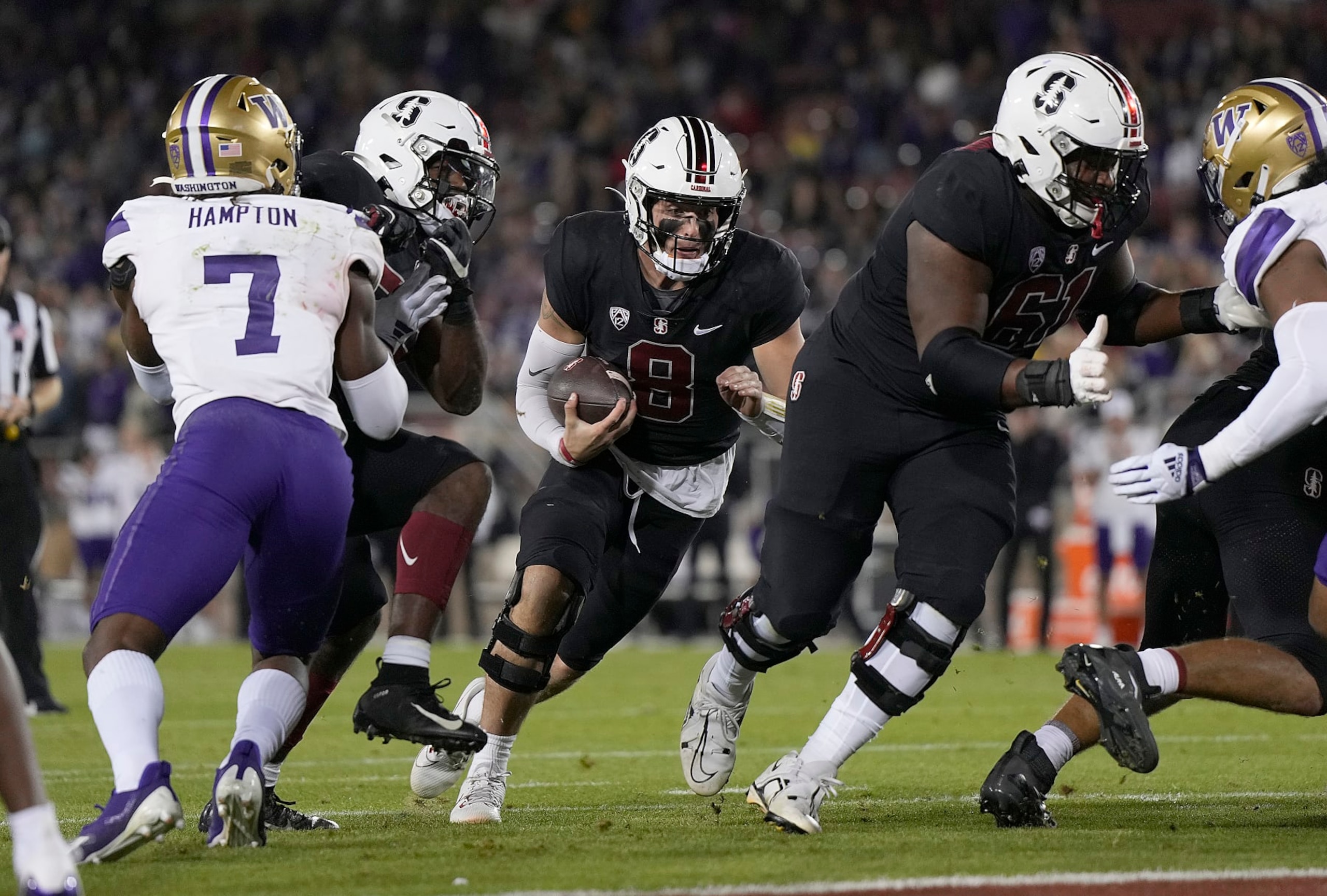 STANFORD, CALIFORNIA - OCTOBER 28: Justin Lamson #8 of the Stanford Cardinal runs for a two yard touchdown against the Washington Huskies in the fourth quarter at Stanford Stadium on October 28, 2023 in Stanford, California. (Photo by Thearon W. Henderson/Getty Images)