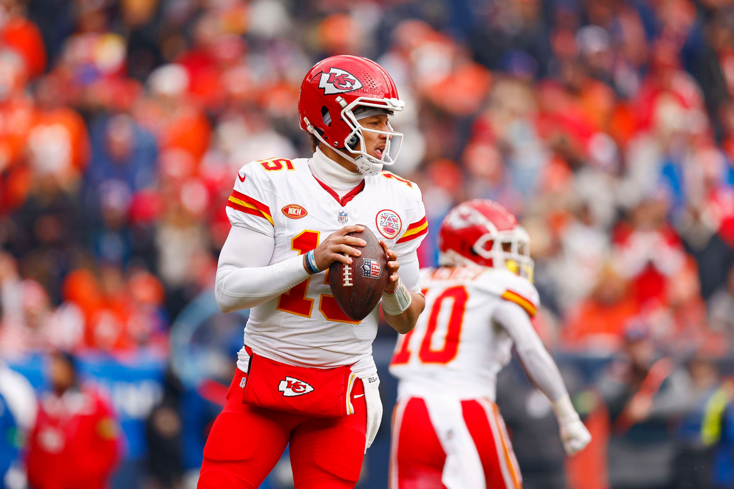 DENVER, COLORADO - OCTOBER 29: Patrick Mahomes #15 of the Kansas City Chiefs looks to throw the ball during the first quarter against the Denver Broncos at Empower Field At Mile High on October 29, 2023 in Denver, Colorado. (Photo by Justin Edmonds/Getty Images)