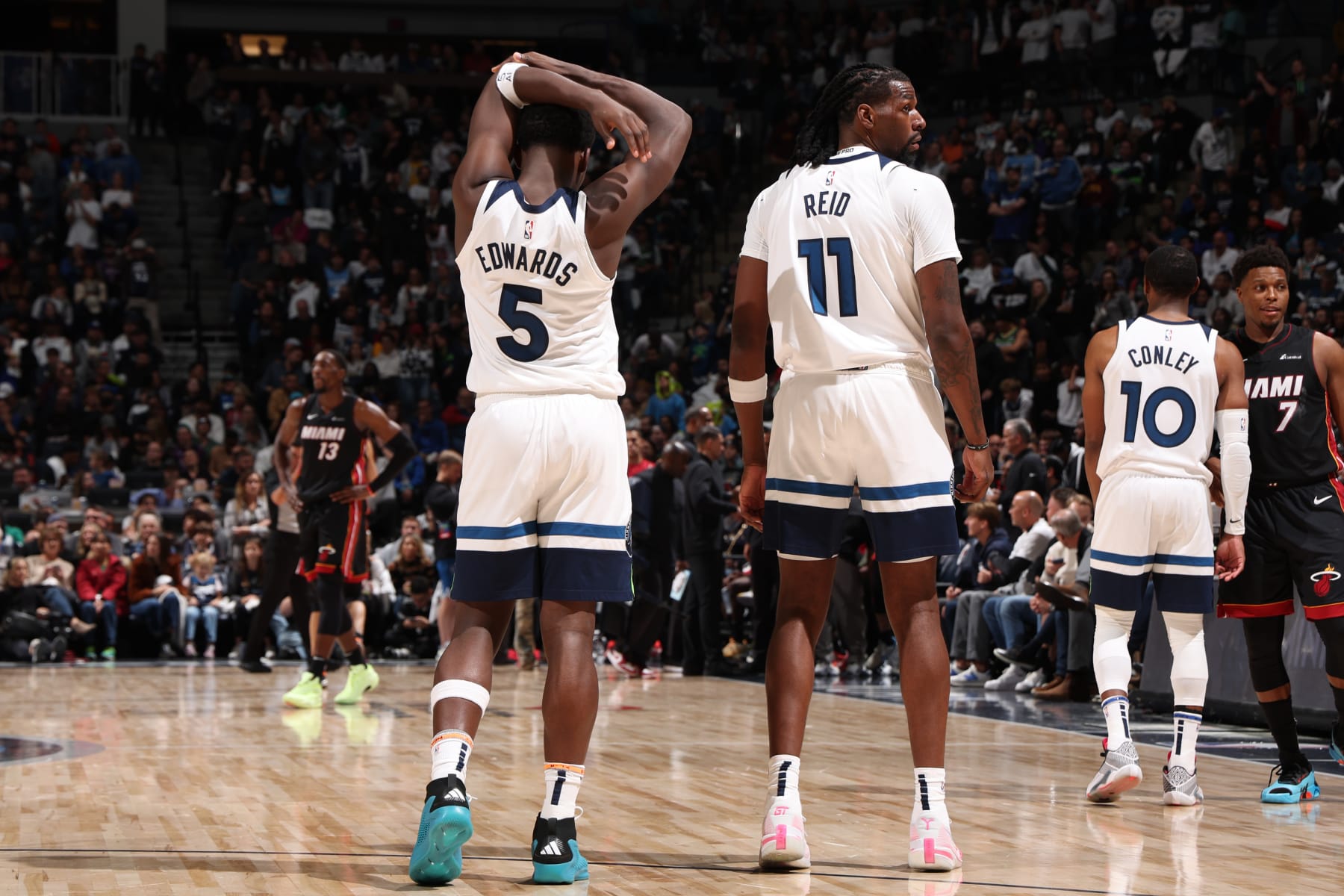 Anthony Edwards, Naz Reid and Mike Conley