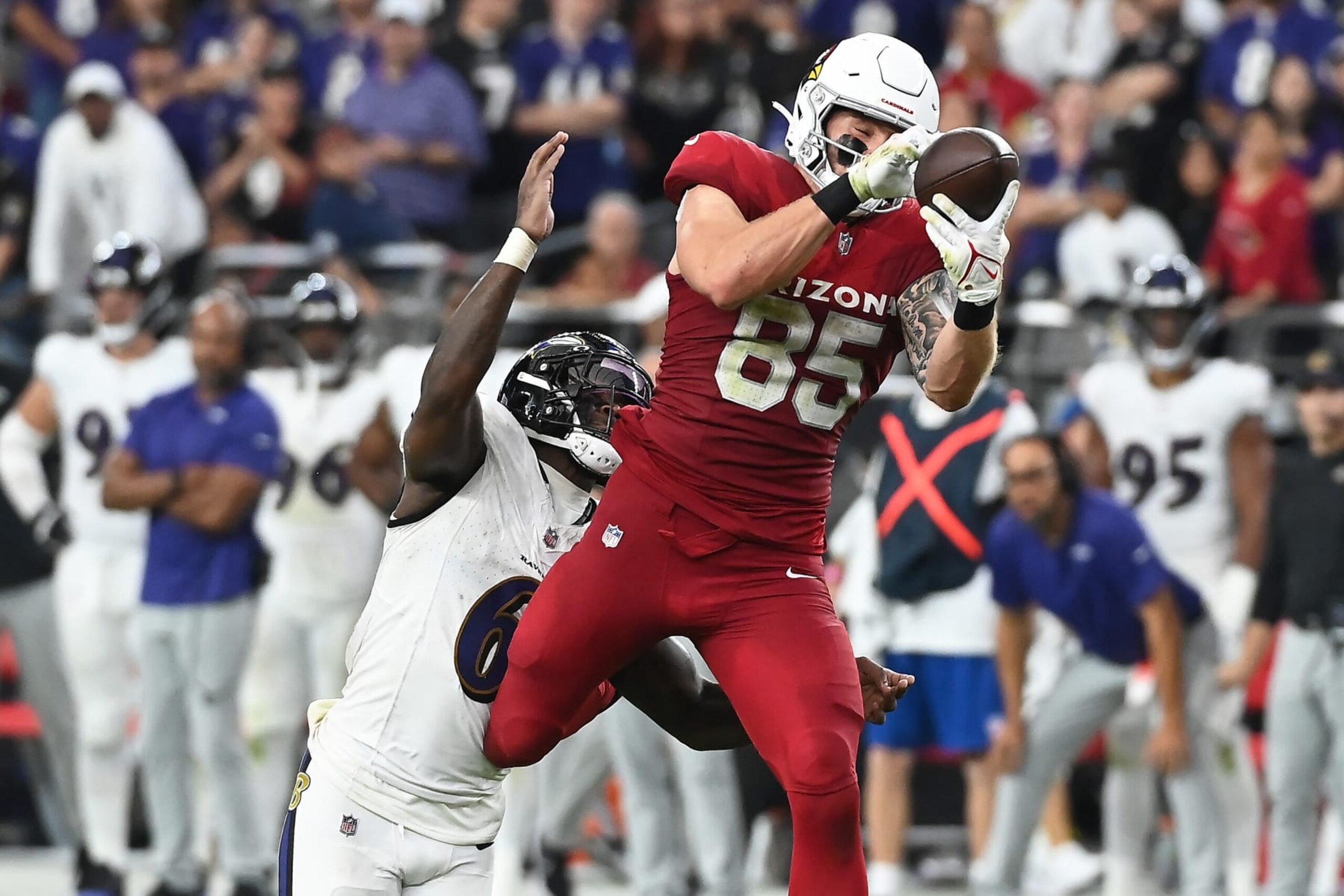GLENDALE, ARIZONA - OCTOBER 29: Trey McBride #85 of the Arizona Cardinals catches a pass in front of Patrick Queen #6 of the Baltimore Ravens during the fourth quarter at State Farm Stadium on October 29, 2023 in Glendale, Arizona. (Photo by Norm Hall/Getty Images)