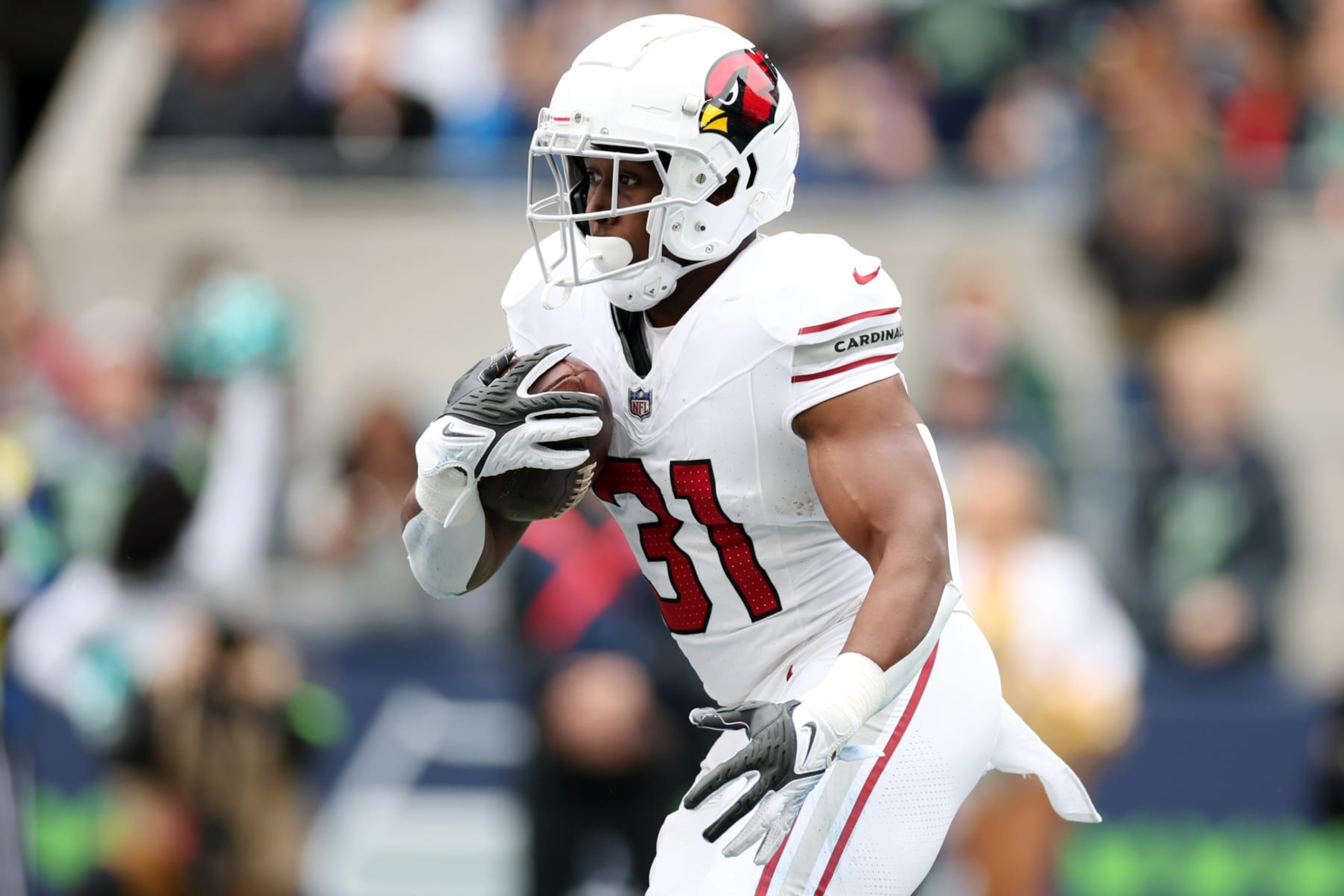 SEATTLE, WASHINGTON - OCTOBER 22: Emari Demercado #31 of the Arizona Cardinals runs with the ball in the first quarter of the game against the Seattle Seahawks at Lumen Field on October 22, 2023 in Seattle, Washington. (Photo by Steph Chambers/Getty Images) SEATTLE, WASHINGTON - OCTOBER 22: Emari Demercado #31 of the Arizona Cardinals runs with the ball in the first quarter of the game against the Seattle Seahawks at Lumen Field on October 22, 2023 in Seattle, Washington. (Photo by Steph Chambers/Getty Images)