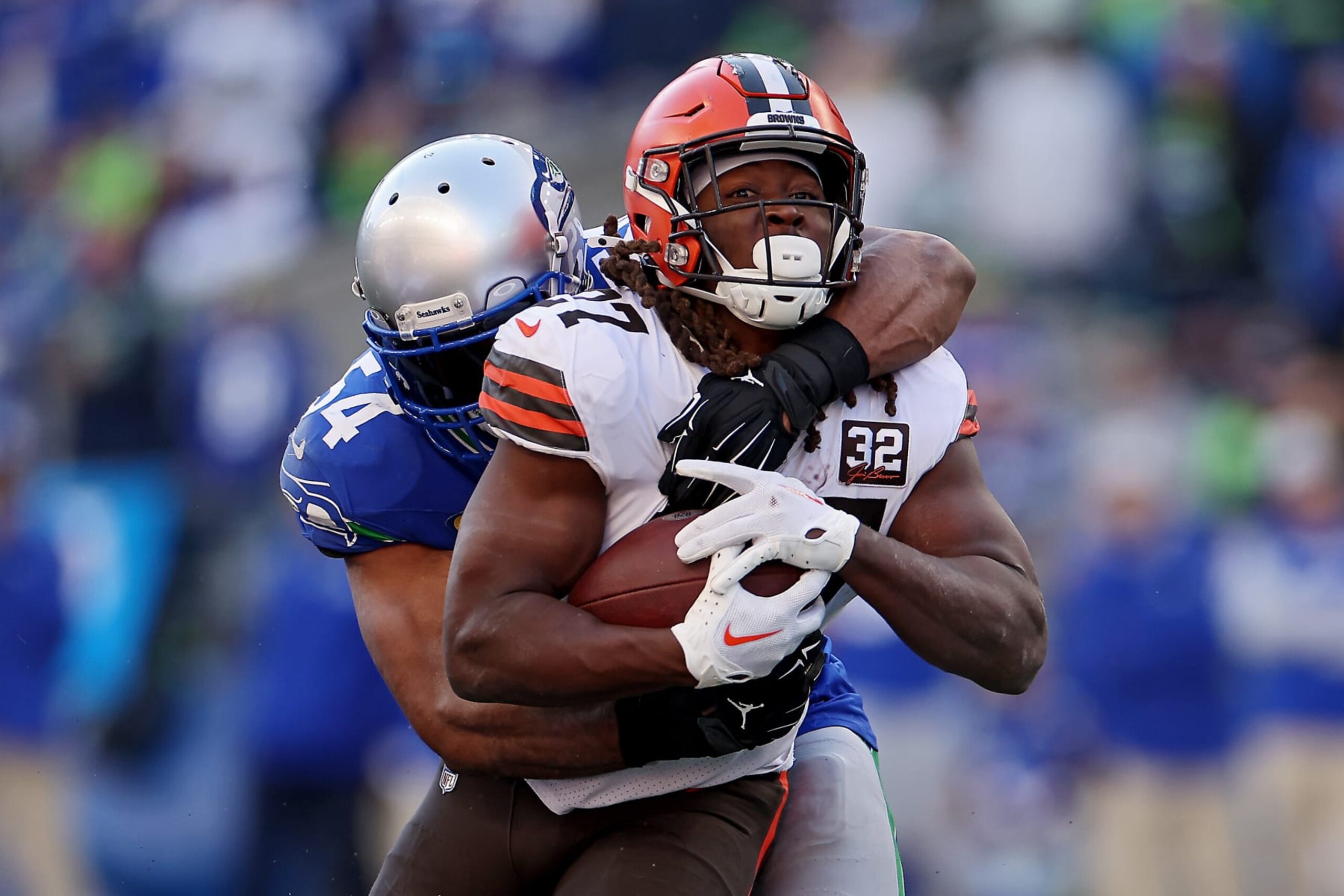 SEATTLE, WASHINGTON - OCTOBER 29: Bobby Wagner #54 of the Seattle Seahawks tackles Kareem Hunt #27 of the Cleveland Browns during the third quarter at Lumen Field on October 29, 2023 in Seattle, Washington. (Photo by Steph Chambers/Getty Images)
