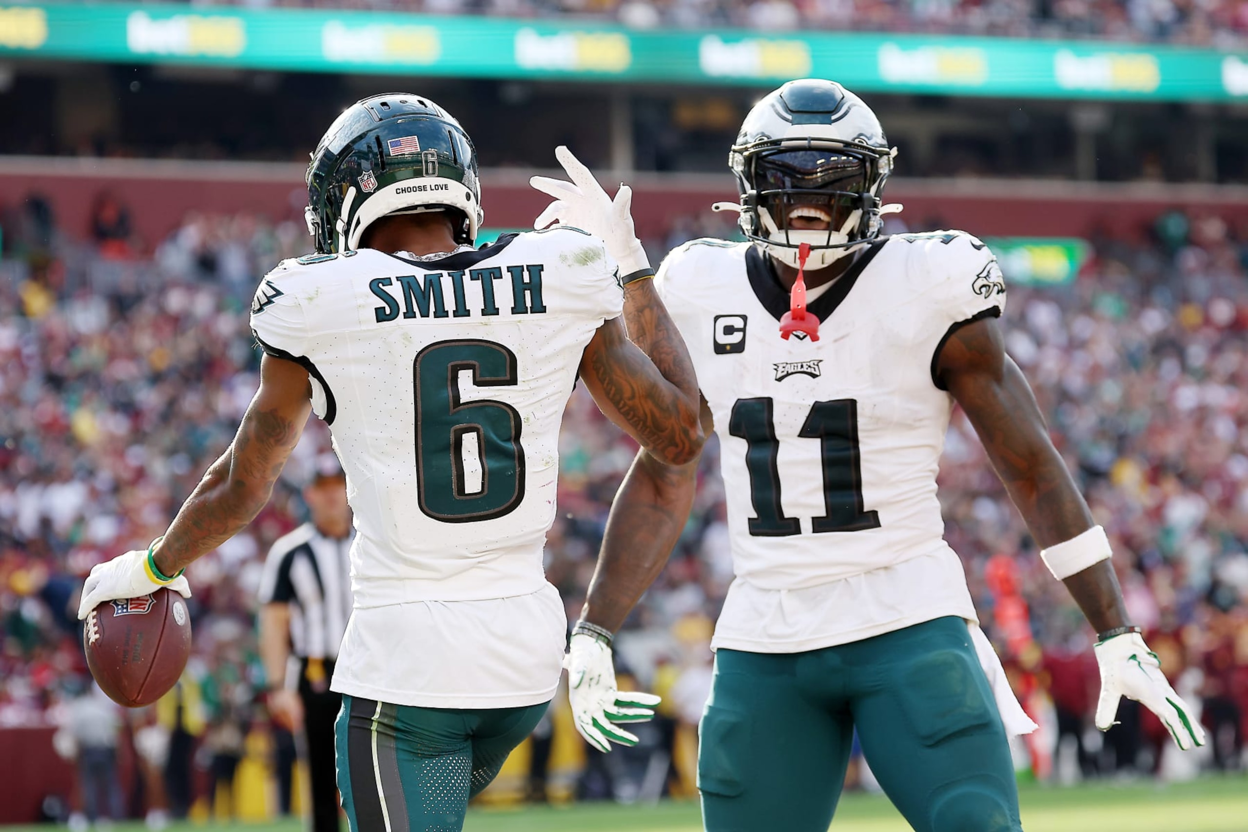 LANDOVER, MARYLAND - OCTOBER 29: DeVonta Smith #6 of the Philadelphia Eagles celebrates a touchdown with A.J. Brown #11 during the fourth quarter against the Washington Commanders at FedExField on October 29, 2023 in Landover, Maryland. (Photo by Patrick Smith/Getty Images)