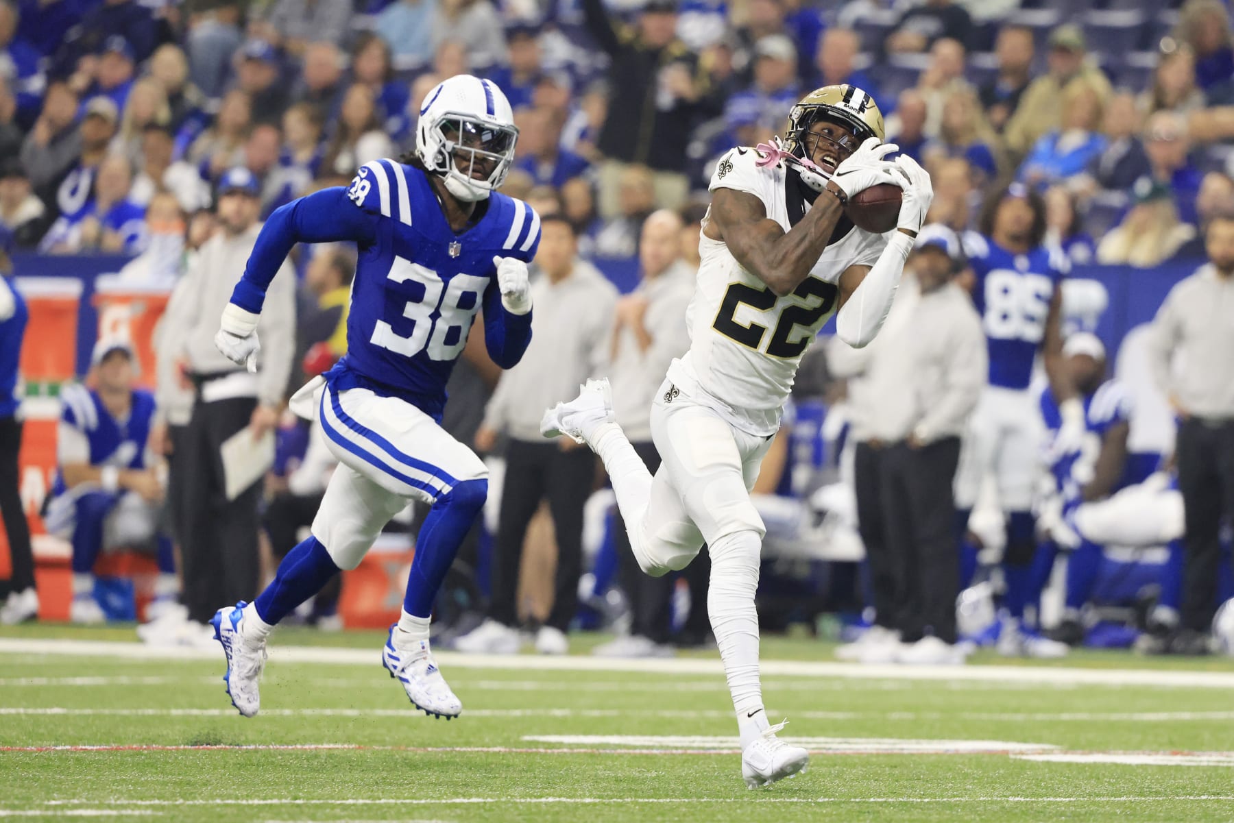 INDIANAPOLIS, INDIANA - OCTOBER 29: Rashid Shaheed #22 of the New Orleans Saints catches a touchdown pass while Tony Brown #38 of the Indianapolis Colts pursues during the second quarter at Lucas Oil Stadium on October 29, 2023 in Indianapolis, Indiana. (Photo by Justin Casterline/Getty Images)