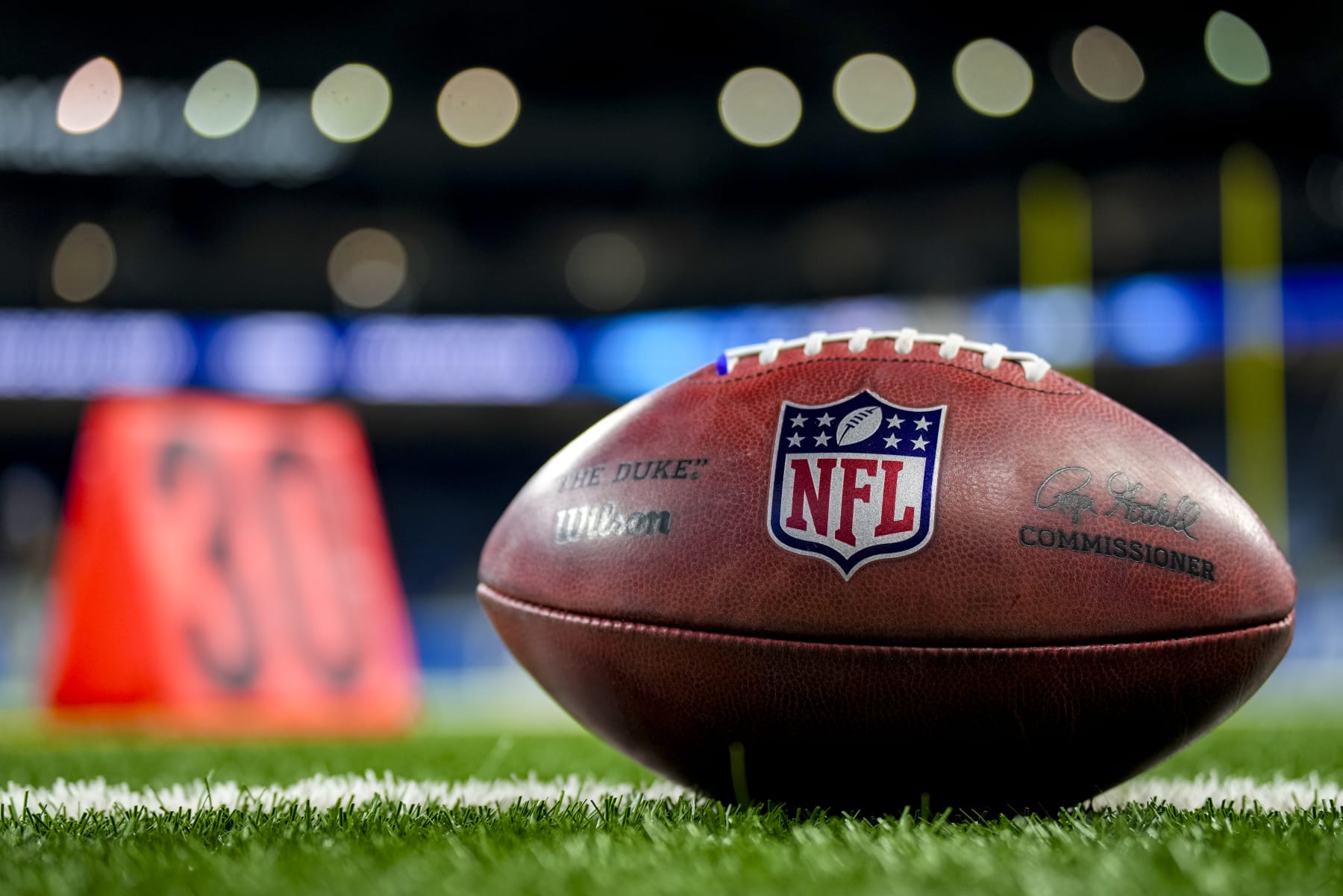 DETROIT, MICHIGAN - OCTOBER 08: The NFL logo is pictured on a Wilson brand football before the game between the Detroit Lions and Carolina Panthers at Ford Field on October 08, 2023 in Detroit, Michigan. (Photo by Nic Antaya/Getty Images)