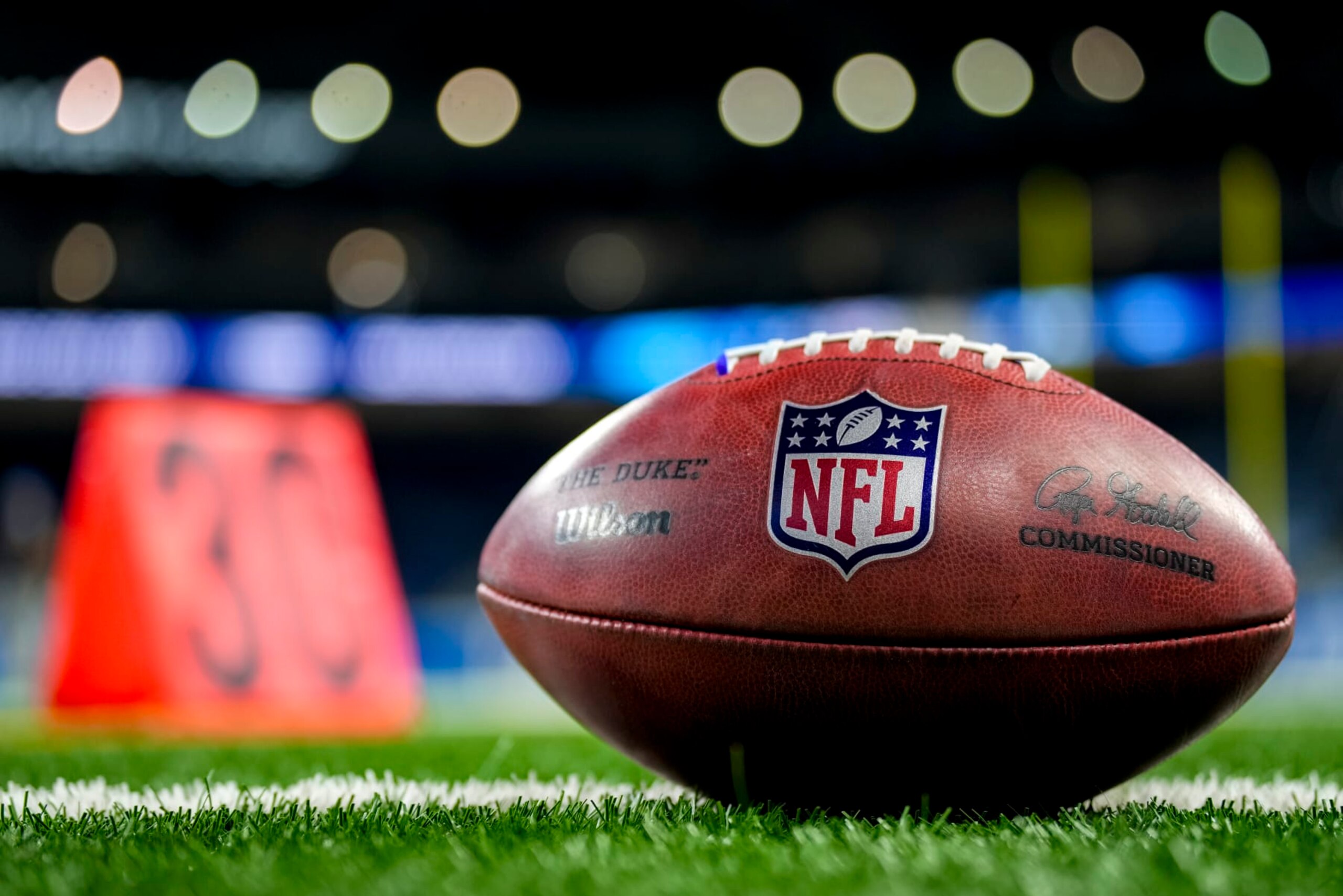 DETROIT, MICHIGAN - OCTOBER 08: The NFL logo is pictured on a Wilson brand football before the game between the Detroit Lions and Carolina Panthers at Ford Field on October 08, 2023 in Detroit, Michigan. (Photo by Nic Antaya/Getty Images)