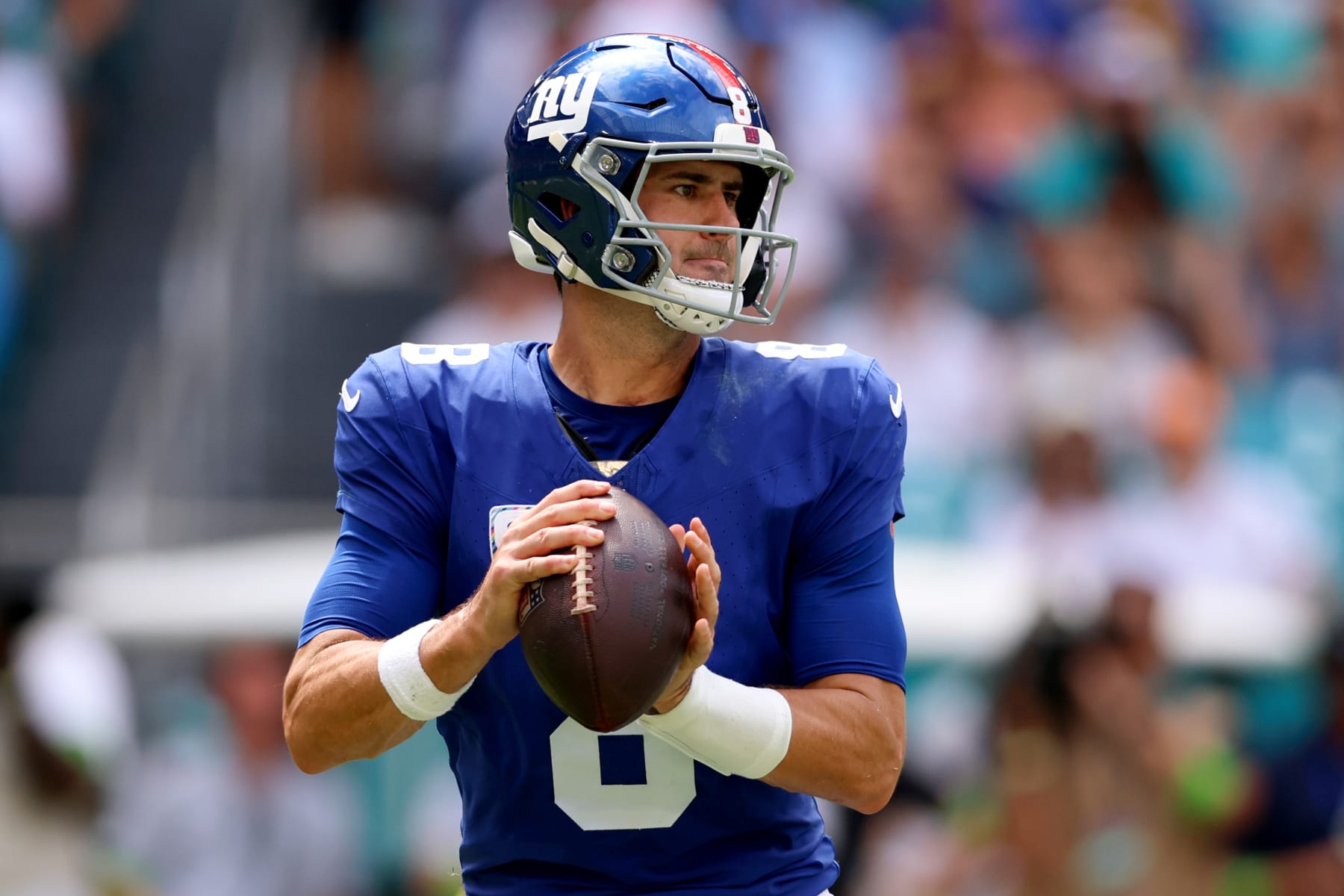 MIAMI GARDENS, FLORIDA - OCTOBER 08: Daniel Jones #8 of the New York Giants looks to pass during the first half against the Miami Dolphins at Hard Rock Stadium on October 08, 2023 in Miami Gardens, Florida. (Photo by Megan Briggs/Getty Images)