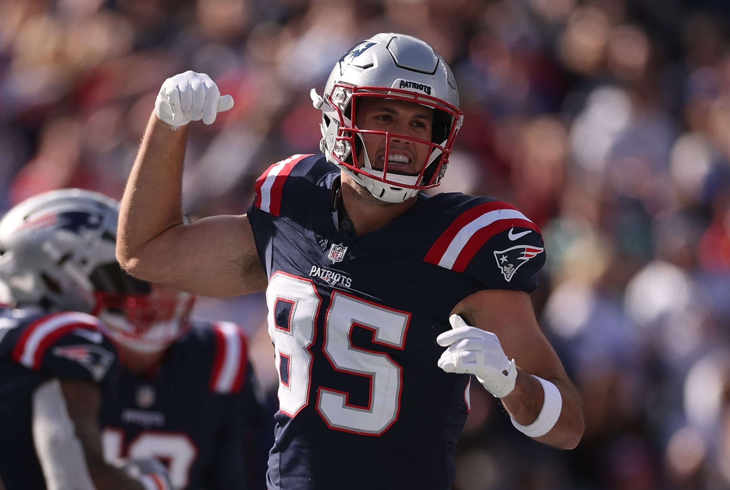FOXBOROUGH, MASSACHUSETTS - OCTOBER 22: Hunter Henry #85 of the New England Patriots celebrates after a touchdown score by Ezekiel Elliot #15 in the first quarter of the game against the Buffalo Bills at Gillette Stadium on October 22, 2023 in Foxborough, Massachusetts. (Photo by Maddie Meyer/Getty Images)
