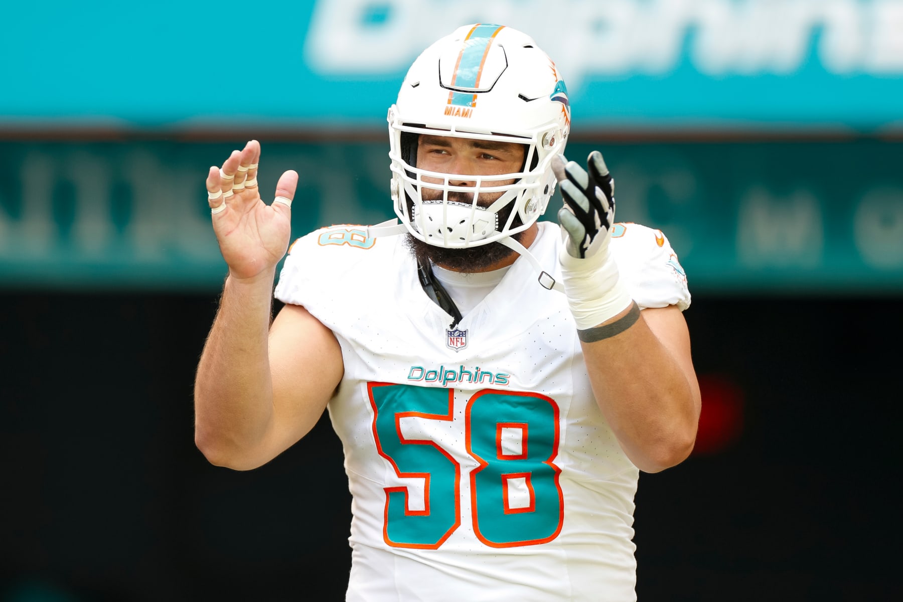 MIAMI GARDENS, FLORIDA - OCTOBER 8: Connor Williams #58 of the Miami Dolphins runs out of the tunnel during player introductions prior to a game against the New York Giants at Hard Rock Stadium on October 8, 2023 in Miami Gardens, Florida. (Photo by Brandon Sloter/Image Of Sport/Getty Images)