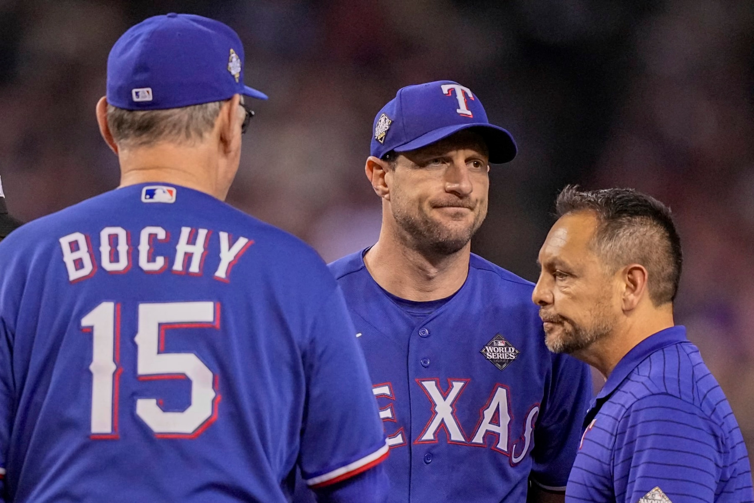 Texas Rangers starting pitcher Max Scherzer leaves the game against the Arizona Diamondbacks during the fourth inning in Game 3 of the baseball World Series Monday, Oct. 30, 2023, in Phoenix. (AP Photo/Brynn Anderson)