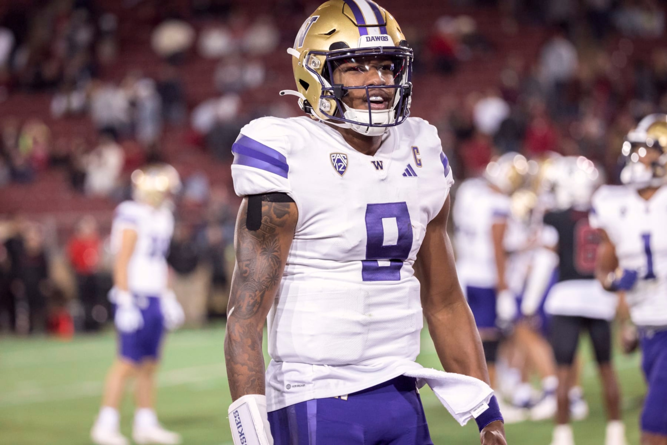 PALO ALTO, CA - OCTOBER  28:  Quarterback Michael Penix Jr. #9 of the Washington Huskies celebrates after throwing a touchdown pass during a Pac-12 NCAA college football game against the Stanford Cardinal on October 28, 2023 at Stanford Stadium in Palo Alto, California.  (Photo by David Madison/Getty Images)