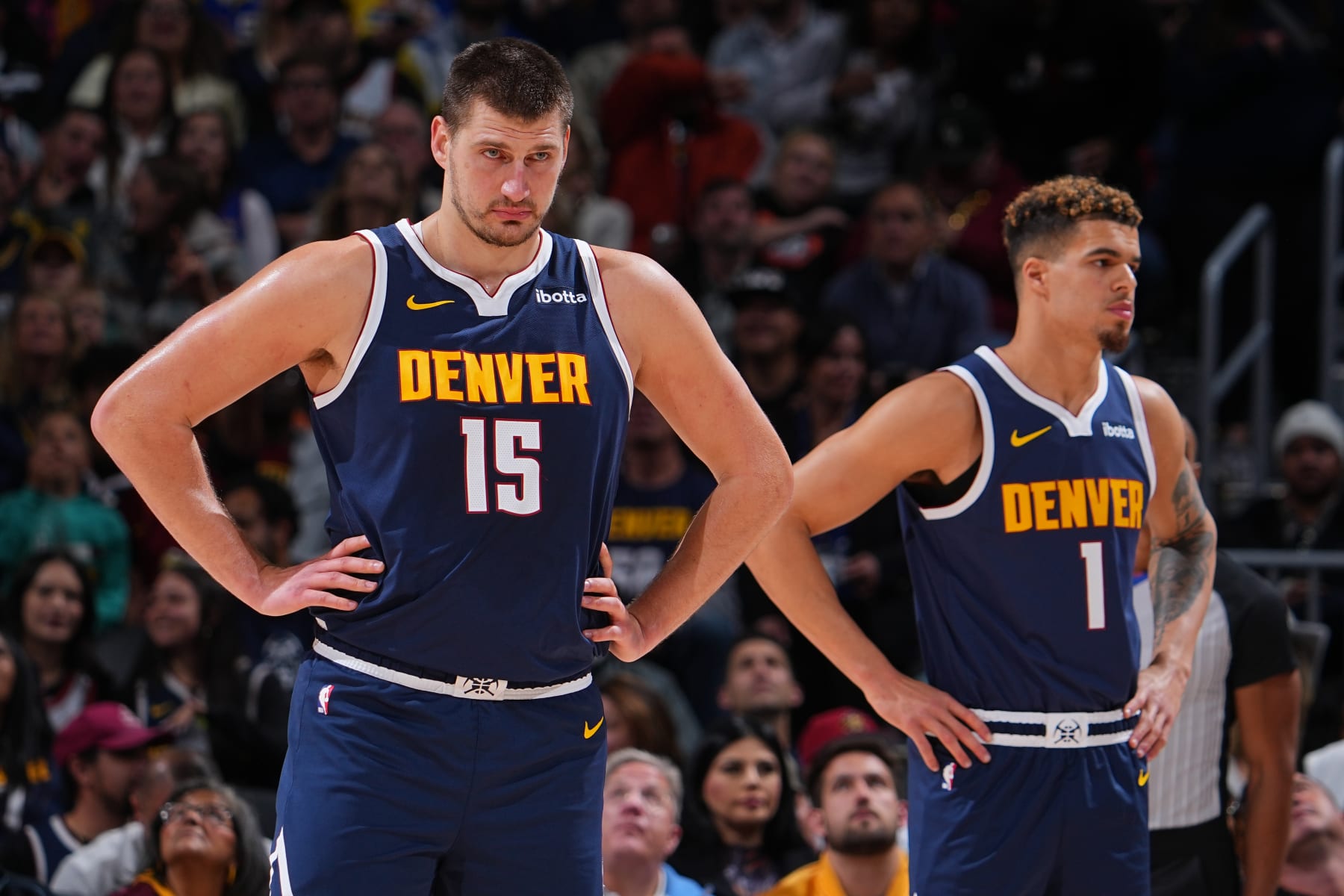 DENVER, CO - OCTOBER 30: Nikola Jokic #15 and Michael Porter Jr. #1 of the Denver Nuggets look on during the game against the Utah Jazz on October 30, 2023 at the Ball Arena in Denver, Colorado. NOTE TO USER: User expressly acknowledges and agrees that, by downloading and/or using this Photograph, user is consenting to the terms and conditions of the Getty Images License Agreement. Mandatory Copyright Notice: Copyright 2023 NBAE (Photo by Bart Young/NBAE via Getty Images)