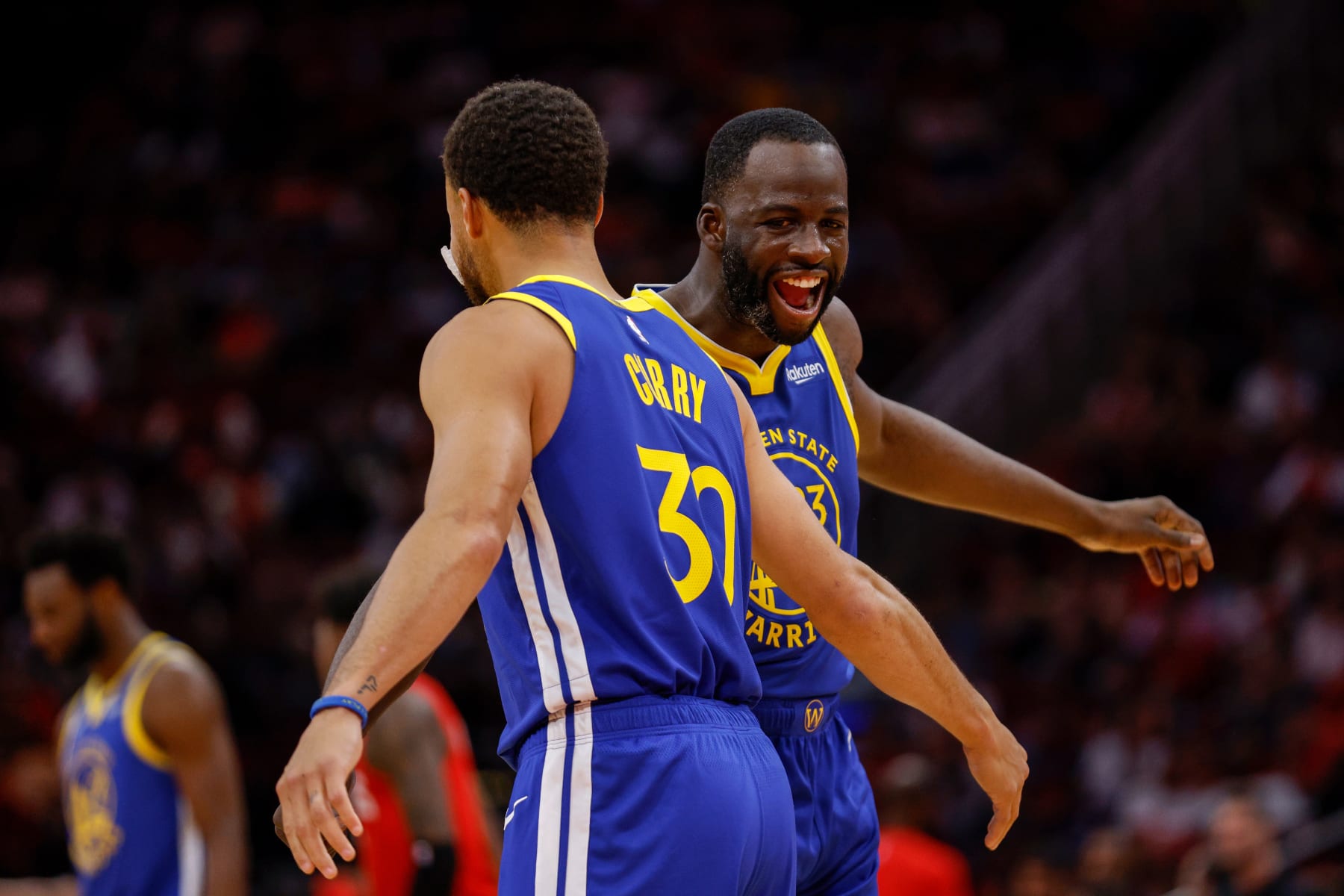 HOUSTON, TEXAS - OCTOBER 29: Draymond Green #23 of the Golden State Warriors and Stephen Curry #30 celebrate in the first half against the Houston Rockets at Toyota Center on October 29, 2023 in Houston, Texas.  NOTE TO USER: User expressly acknowledges and agrees that, by downloading and or using this photograph, User is consenting to the terms and conditions of the Getty Images License Agreement. (Photo by Tim Warner/Getty Images)