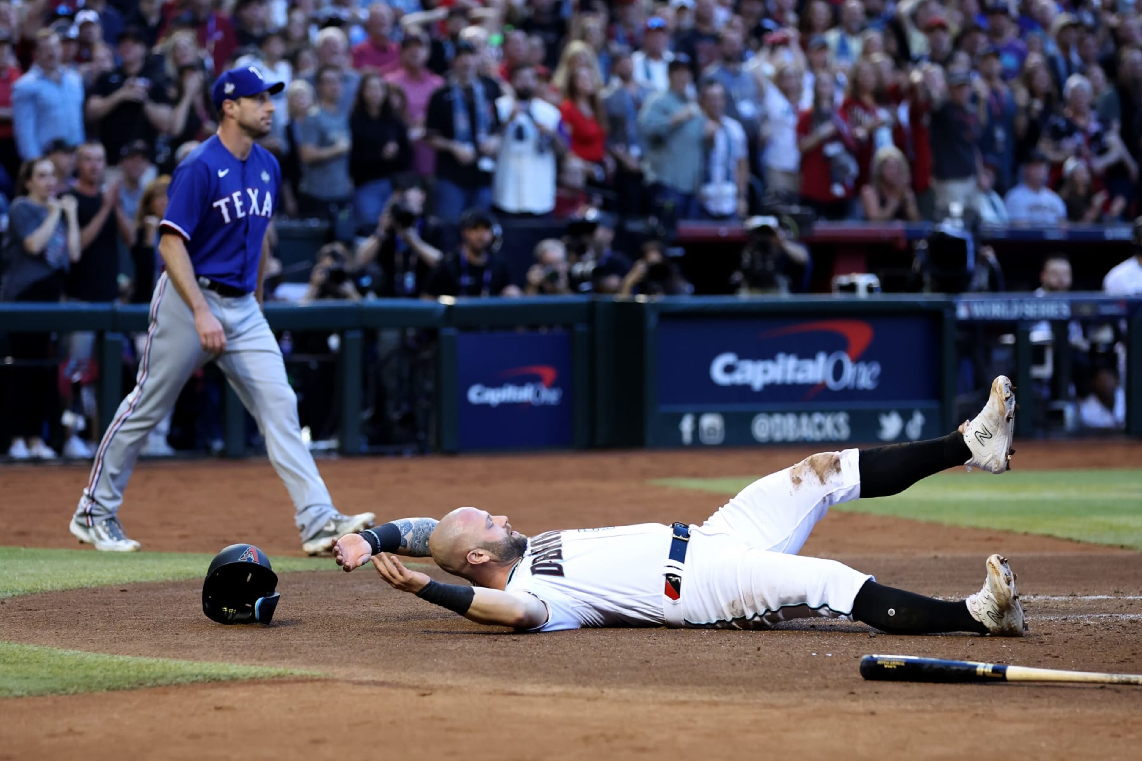 PHOENIX, ARIZONA - OCTOBER 30: Christian Walker #53 of the Arizona Diamondbacks reacts after being tagged out at home plate in the second inning against the Texas Rangers during Game Three of the World Series at Chase Field on October 30, 2023 in Phoenix, Arizona. (Photo by Christian Petersen/Getty Images) PHOENIX, ARIZONA - OCTOBER 30: Christian Walker #53 of the Arizona Diamondbacks reacts after being tagged out at home plate in the second inning against the Texas Rangers during Game Three of the World Series at Chase Field on October 30, 2023 in Phoenix, Arizona. (Photo by Christian Petersen/Getty Images)