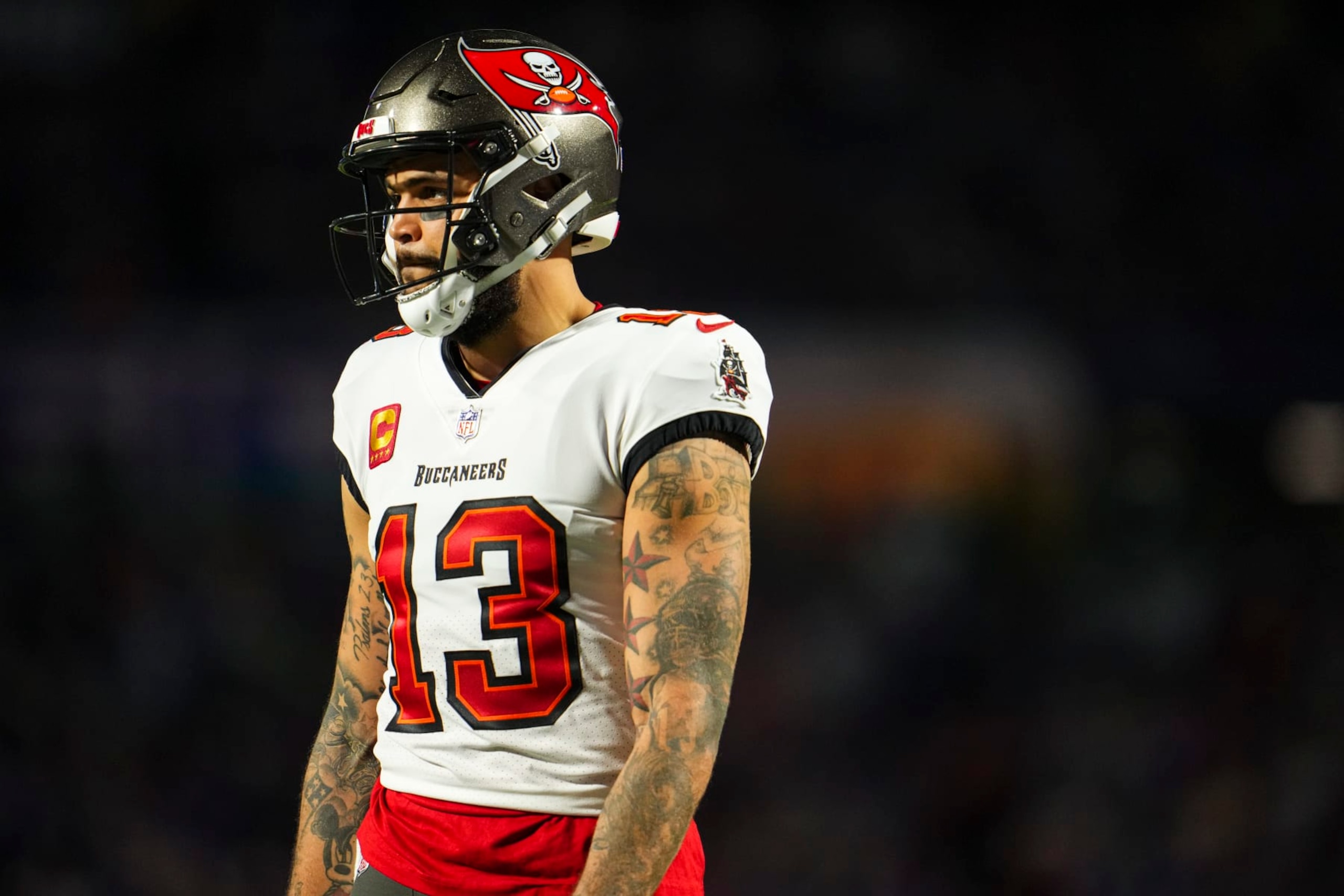 ORCHARD PARK, NY - OCTOBER 26: Mike Evans #13 of the Tampa Bay Buccaneers looks on from the field during an NFL football game against the Buffalo Bills at Highmark Stadium on October 26, 2023 in Orchard Park, New York. (Photo by Cooper Neill/Getty Images) ORCHARD PARK, NY - OCTOBER 26: Mike Evans #13 of the Tampa Bay Buccaneers looks on from the field during an NFL football game against the Buffalo Bills at Highmark Stadium on October 26, 2023 in Orchard Park, New York. (Photo by Cooper Neill/Getty Images)