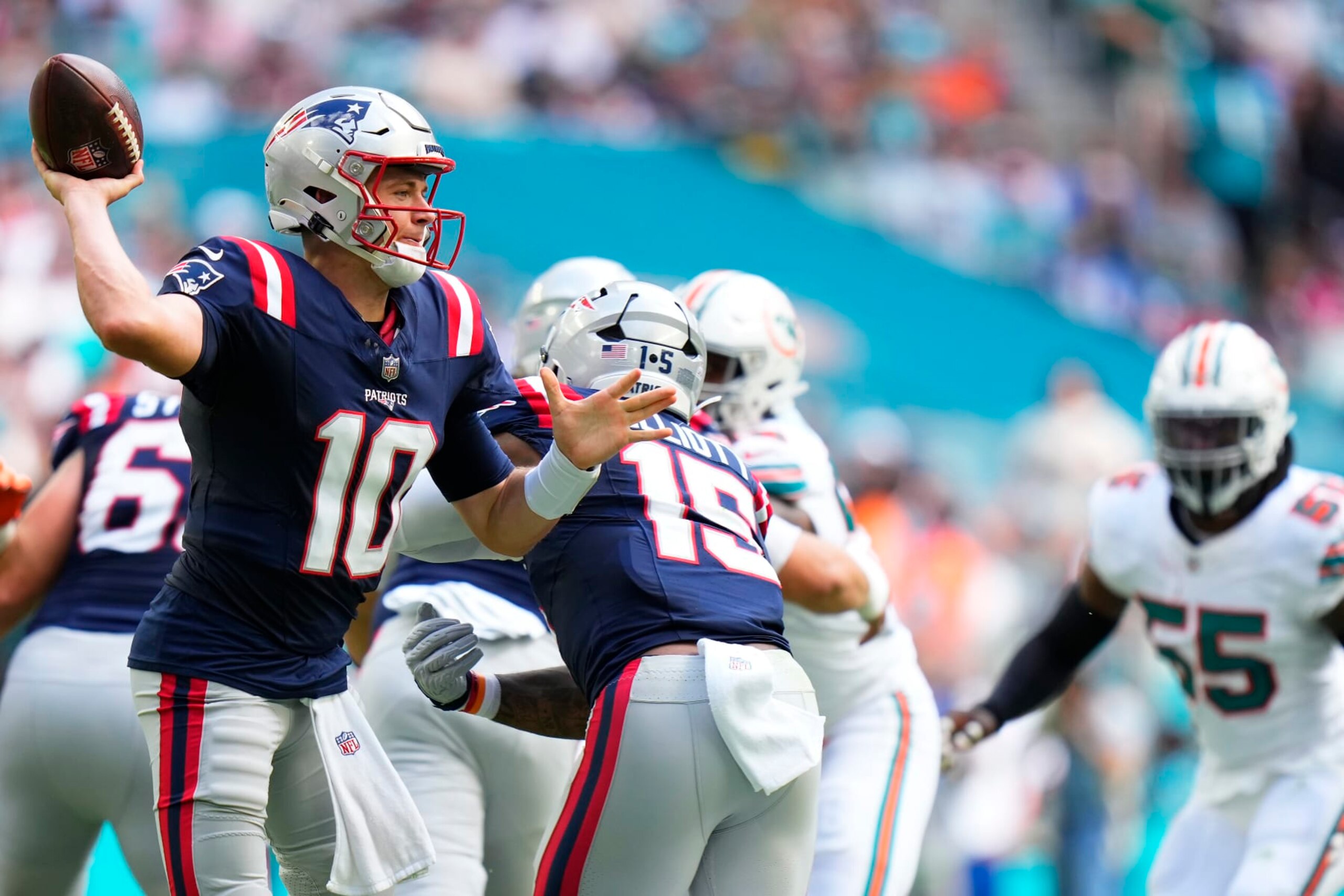 MIAMI GARDENS, FLORIDA - OCTOBER 29: Mac Jones #10 of the New England Patriots attempts a pass during the second quarter against the Miami Dolphins at Hard Rock Stadium on October 29, 2023 in Miami Gardens, Florida. (Photo by Rich Storry/Getty Images)
