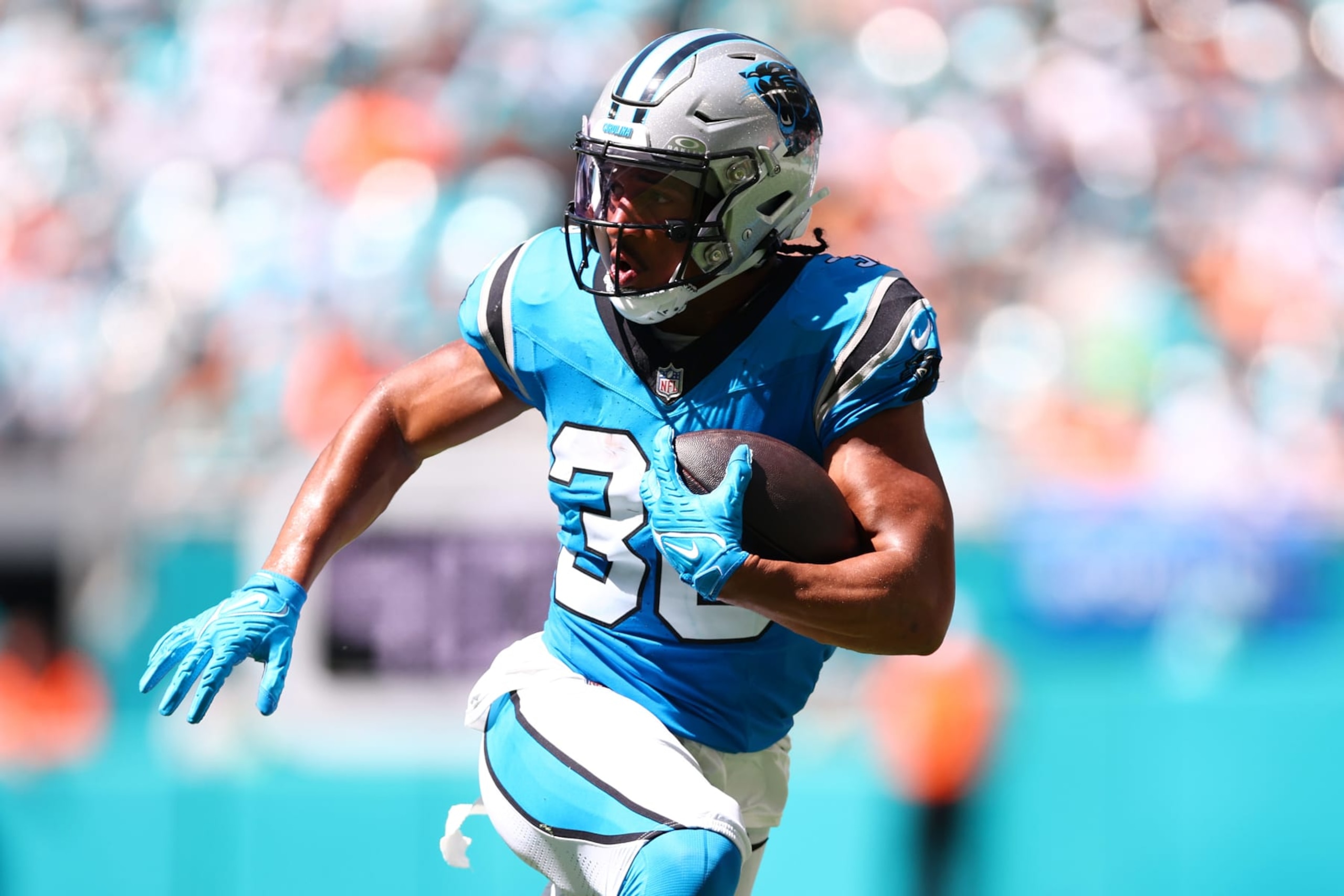 MIAMI GARDENS, FLORIDA - OCTOBER 15: Chuba Hubbard #30 of the Carolina Panthers runs the ball during the first half in the game against the Miami Dolphins at Hard Rock Stadium on October 15, 2023 in Miami Gardens, Florida. (Photo by Megan Briggs/Getty Images)